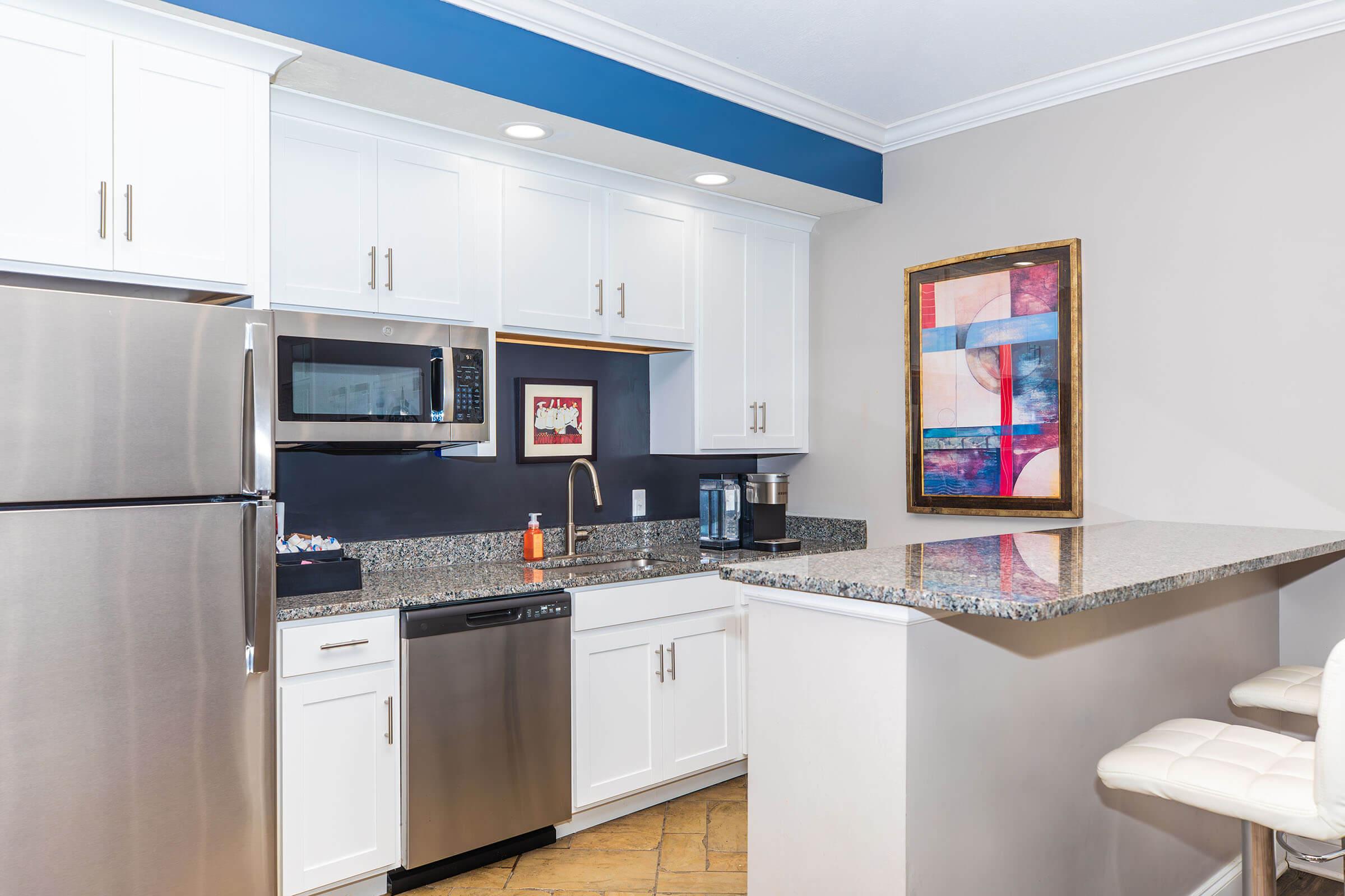 a modern kitchen with stainless steel appliances