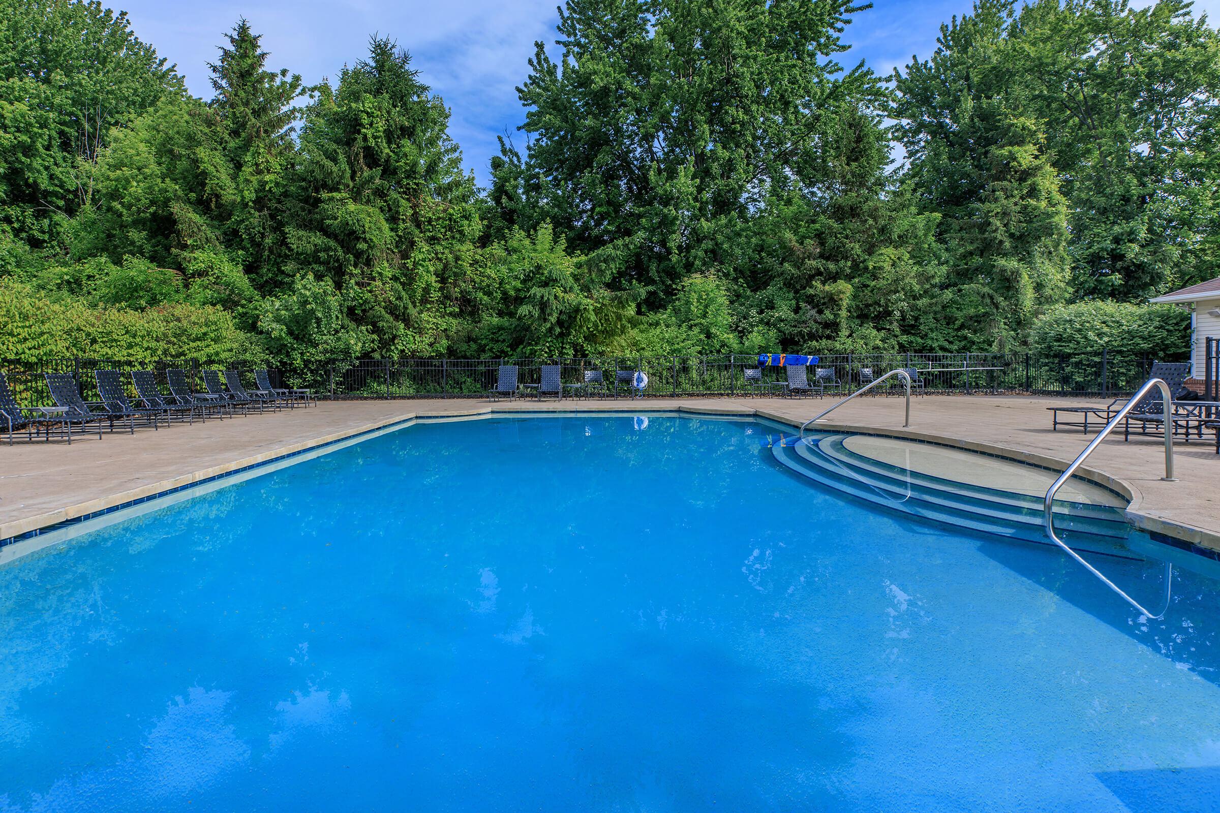 a pool next to a body of water