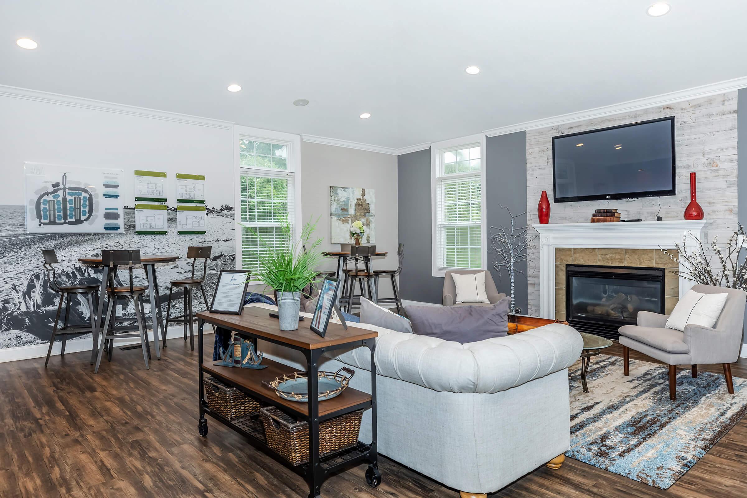 a living room filled with furniture and a fireplace