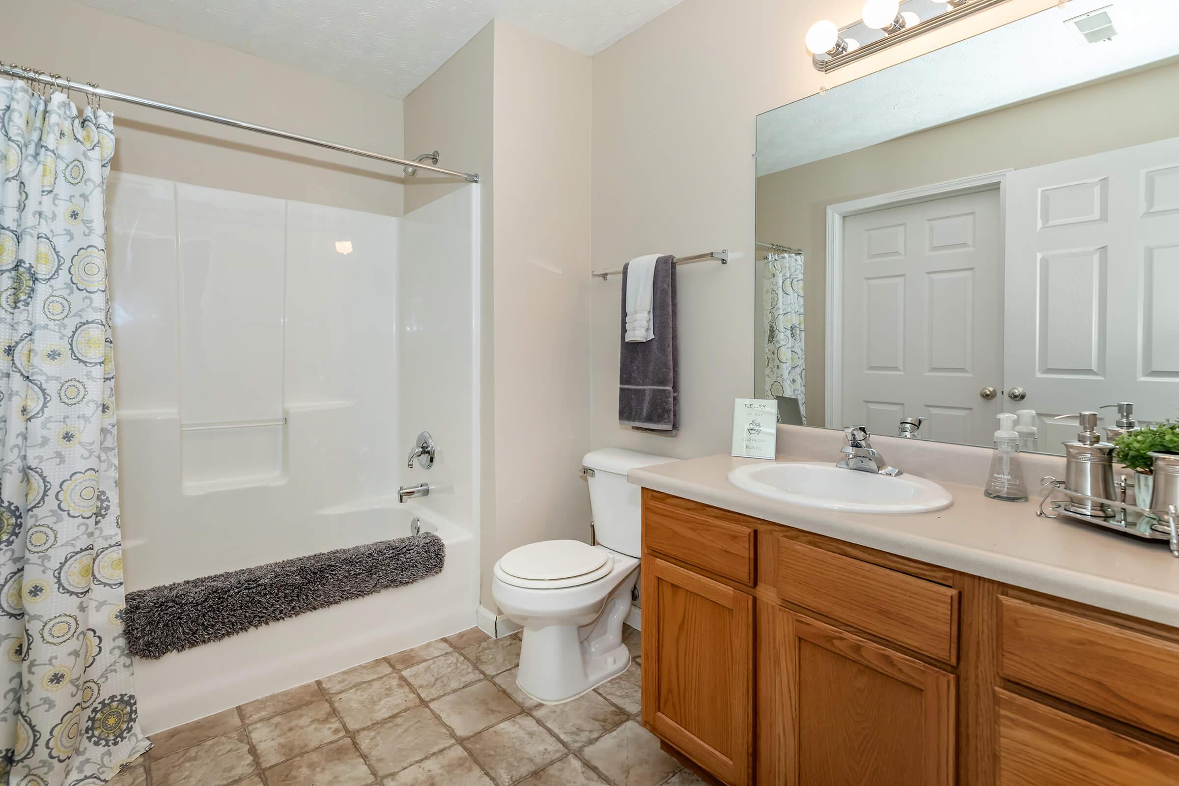 a kitchen with a sink and a mirror