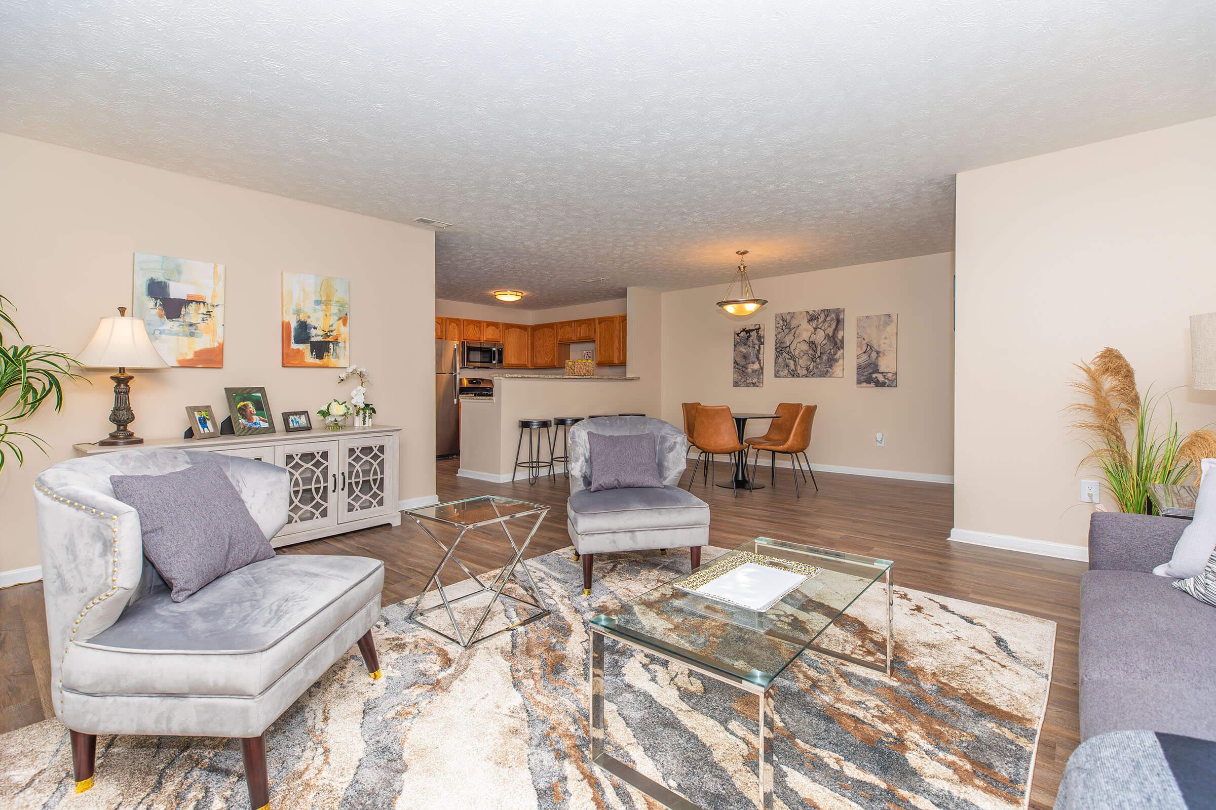 a living room filled with furniture and a flat screen tv