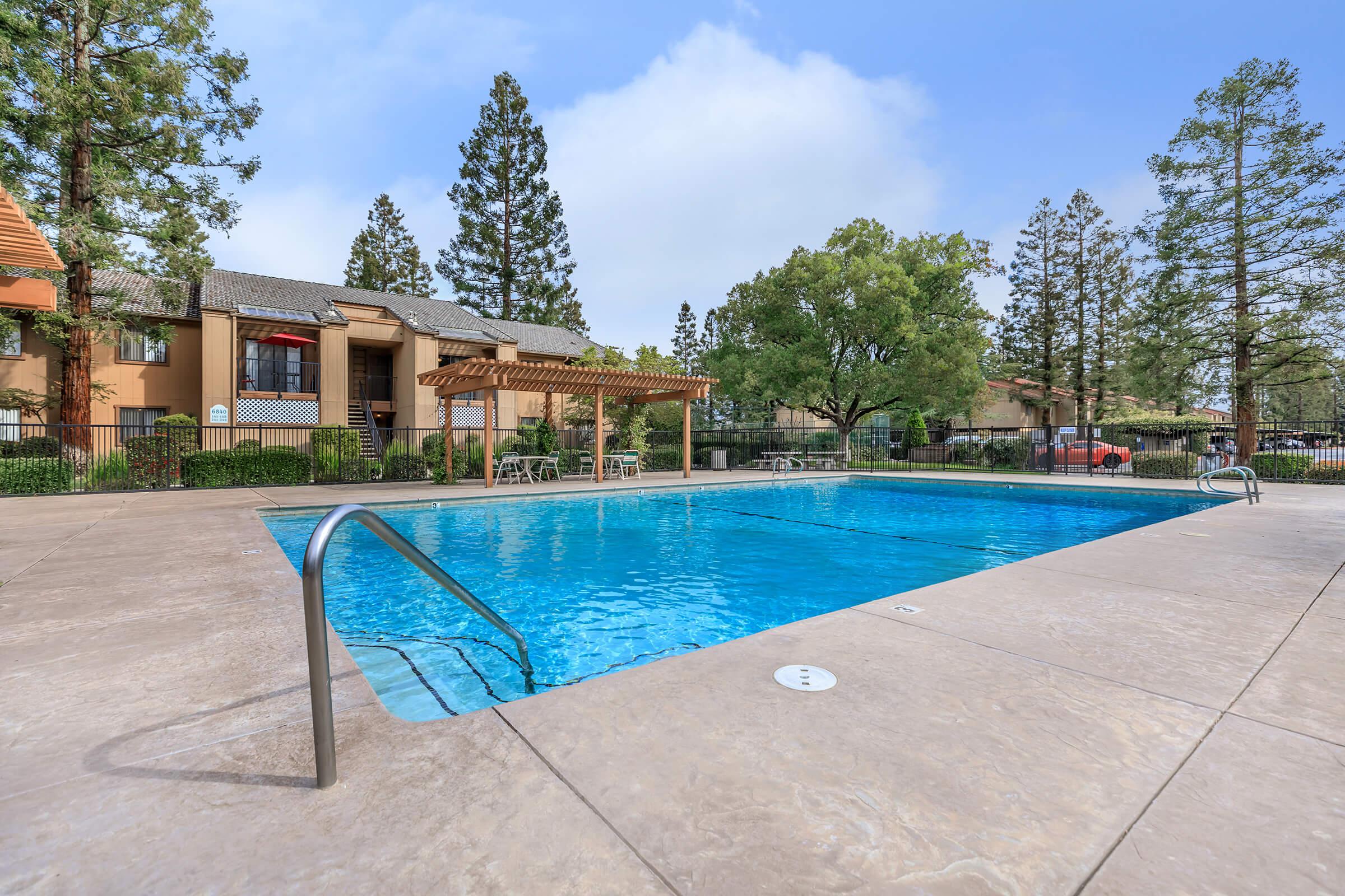 a pool next to a body of water