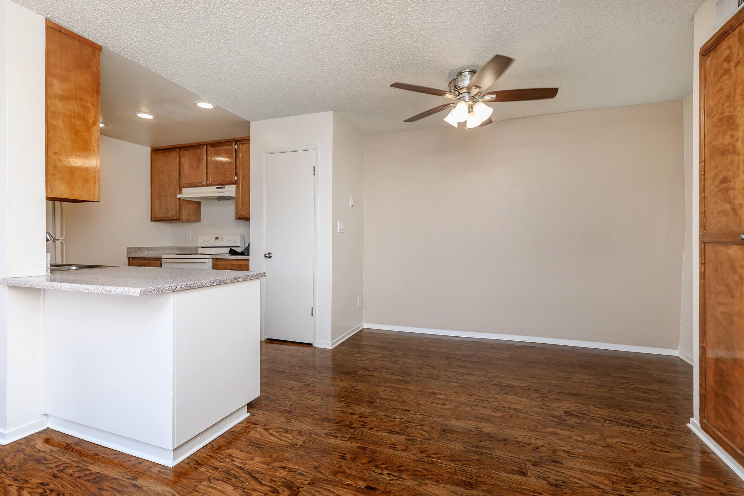 a kitchen with a refrigerator in a room