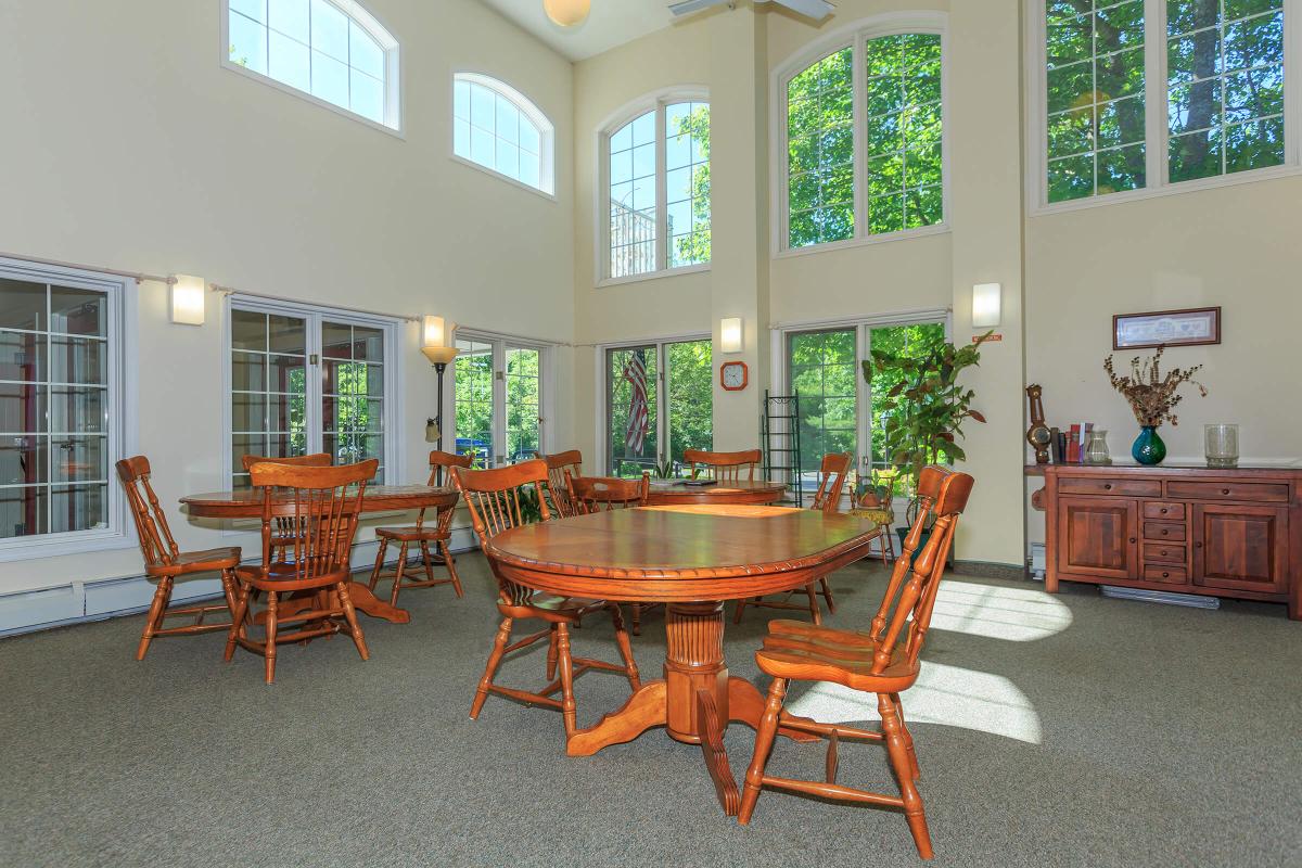 a dining room table in front of a window