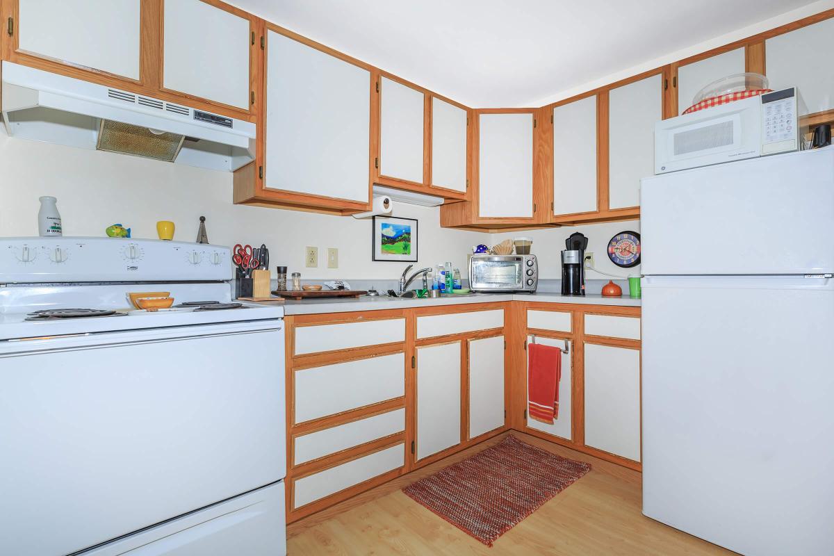 a kitchen with a stove and a refrigerator