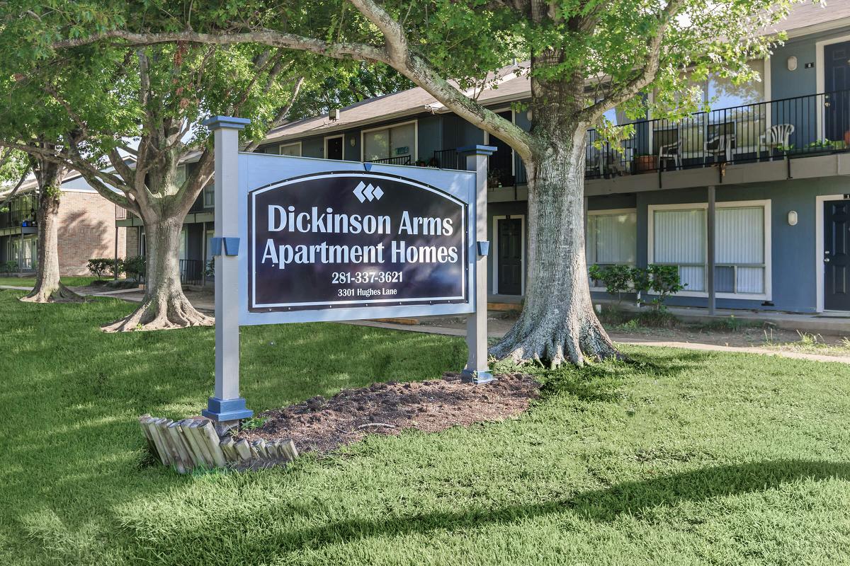 a sign in front of a house