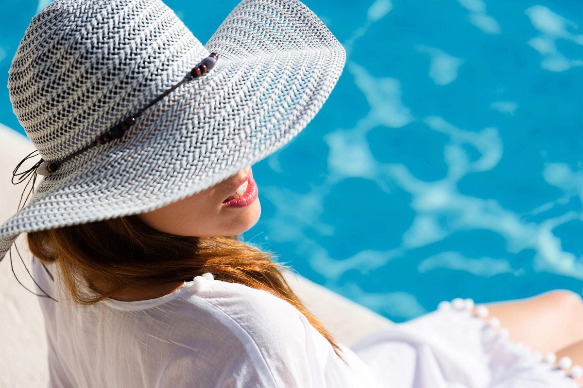 a close up of a person wearing a hat