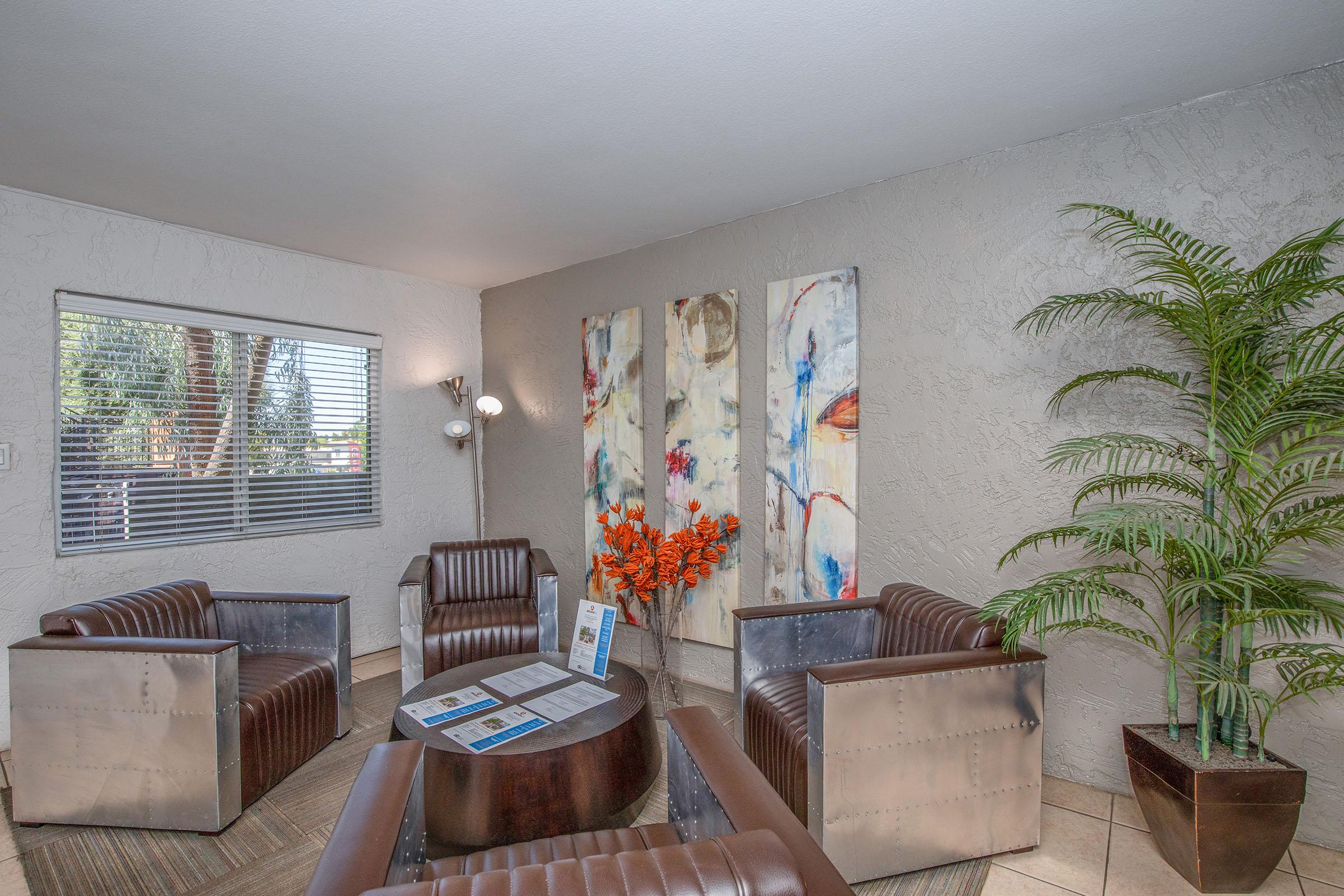 a living room filled with furniture and a large window