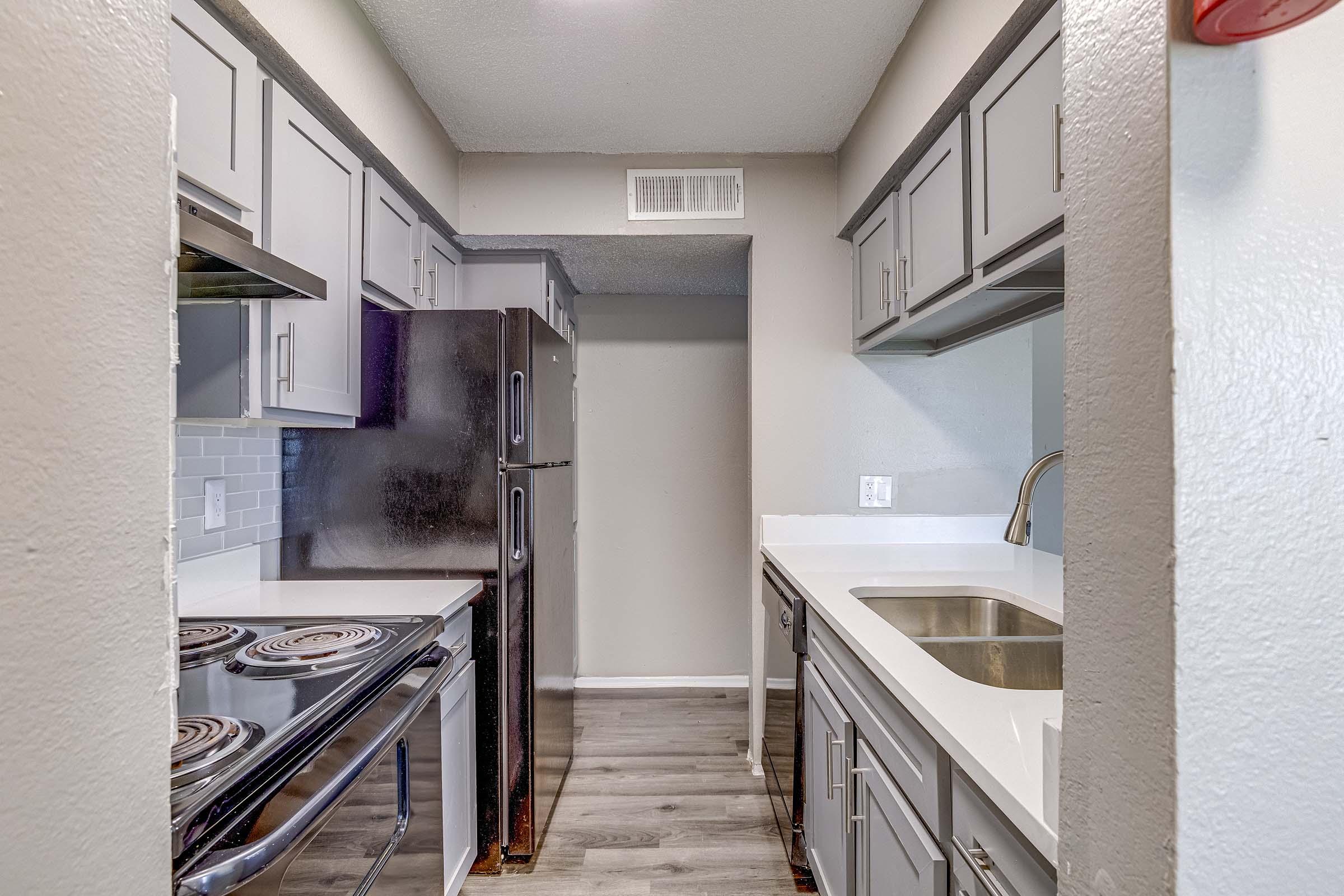 a kitchen with a building in the background