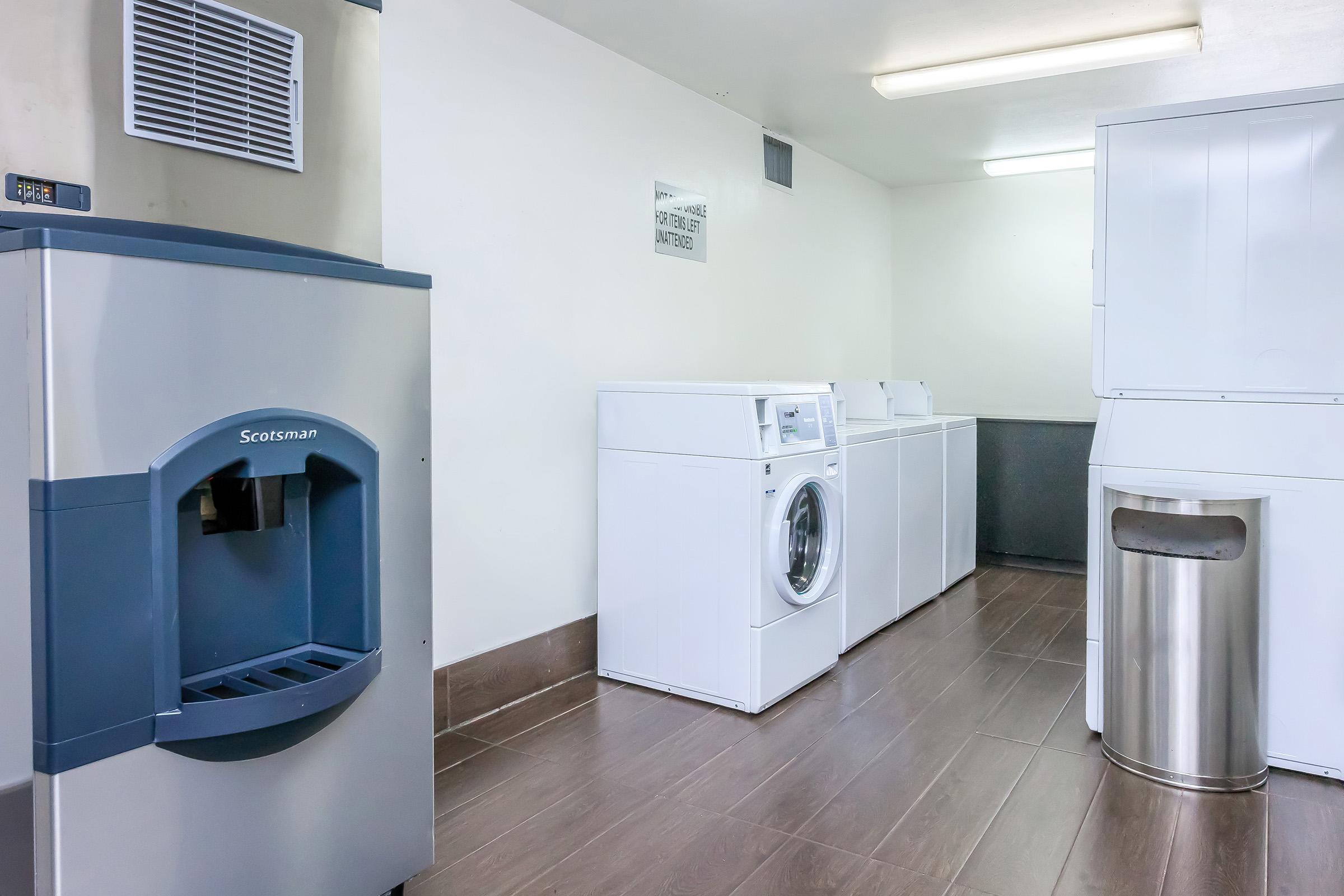 a kitchen with a sink and a refrigerator