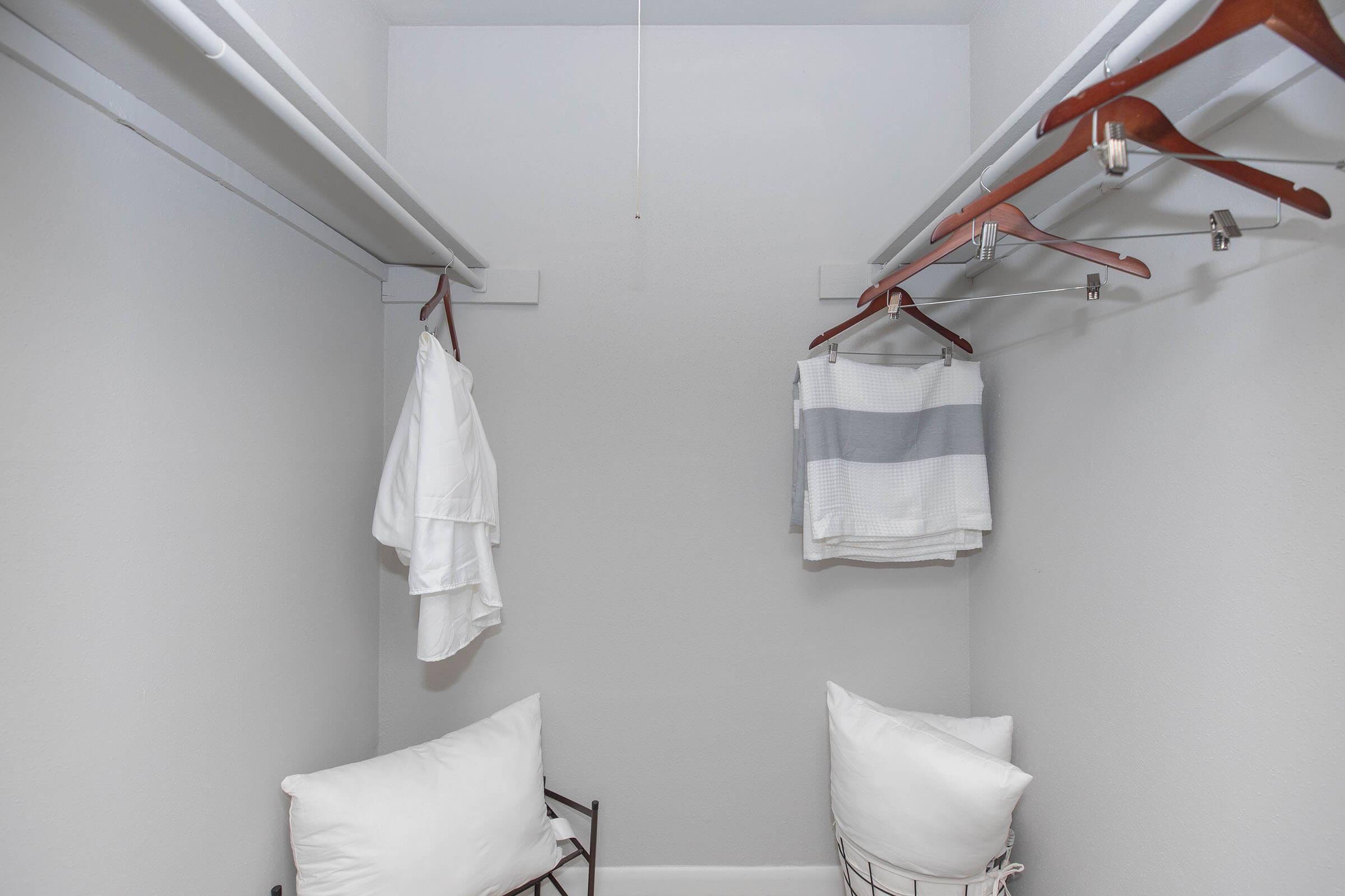 a bedroom with a towel hanging on the wall
