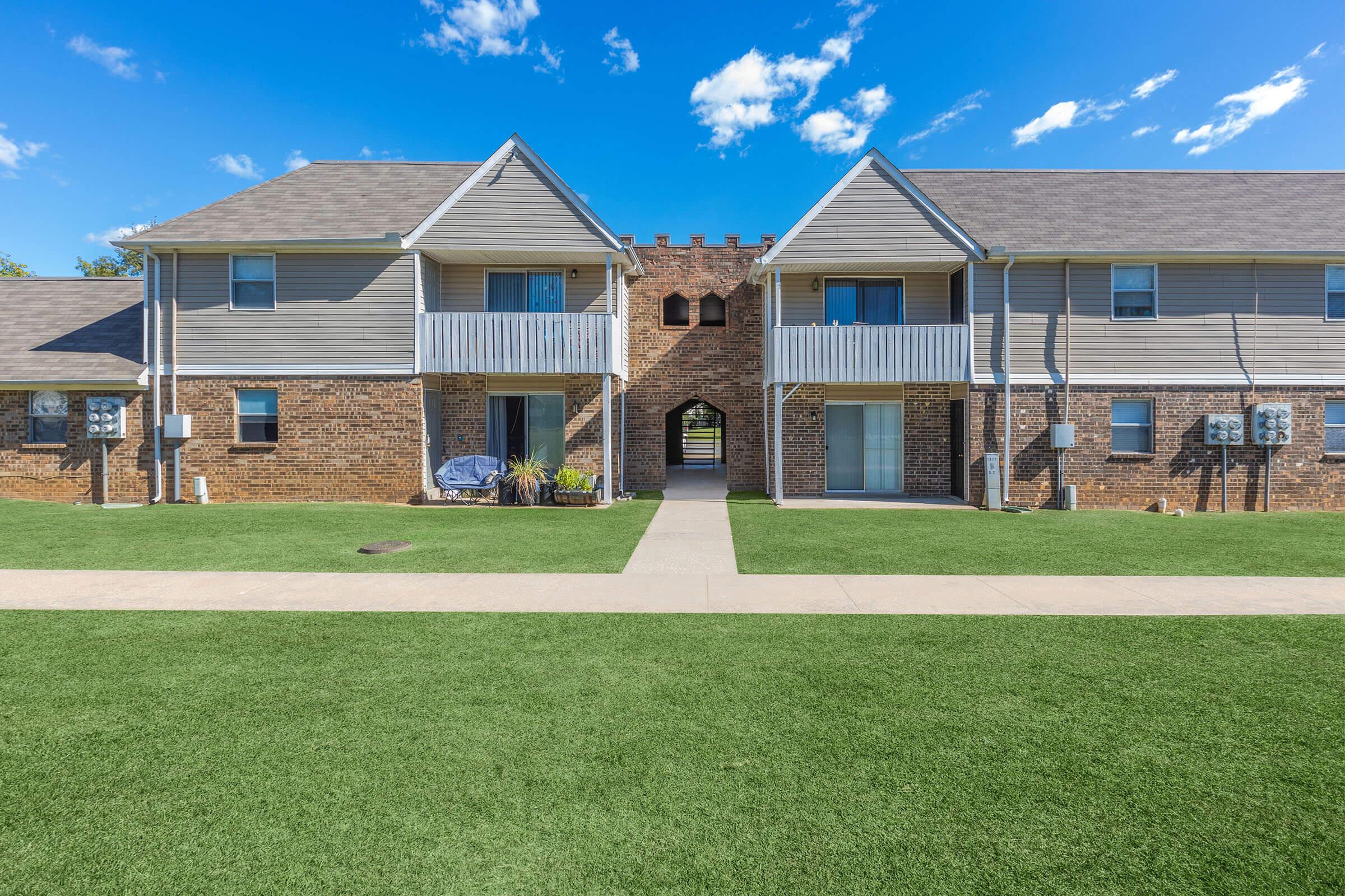 a large lawn in front of a house