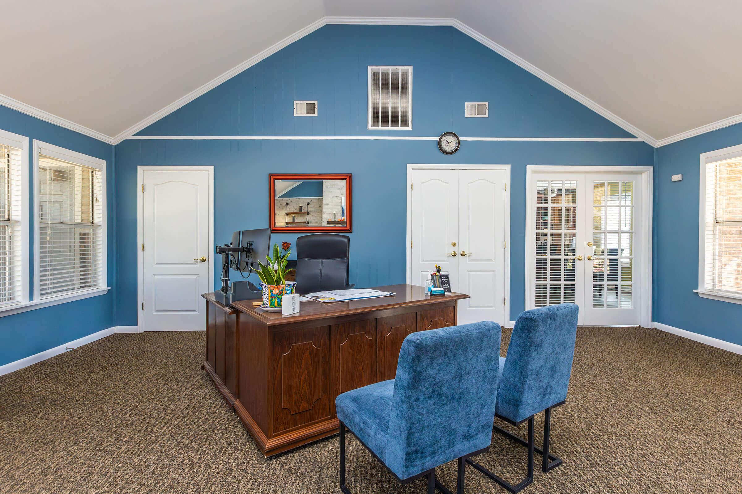 a room filled with furniture and a large window