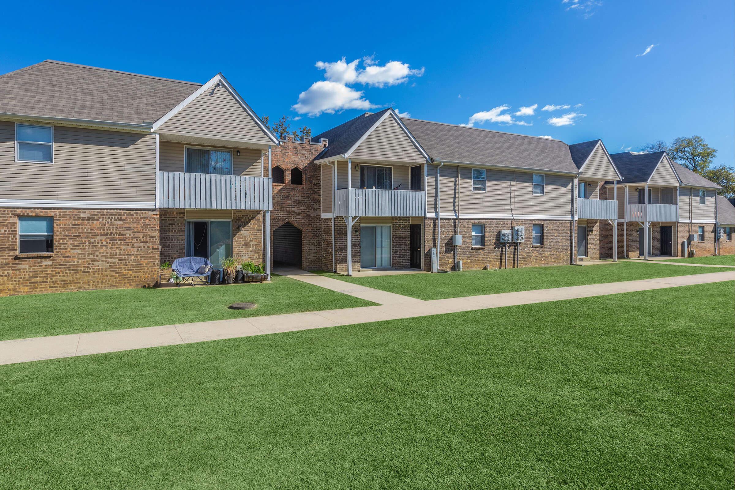 a large lawn in front of a house