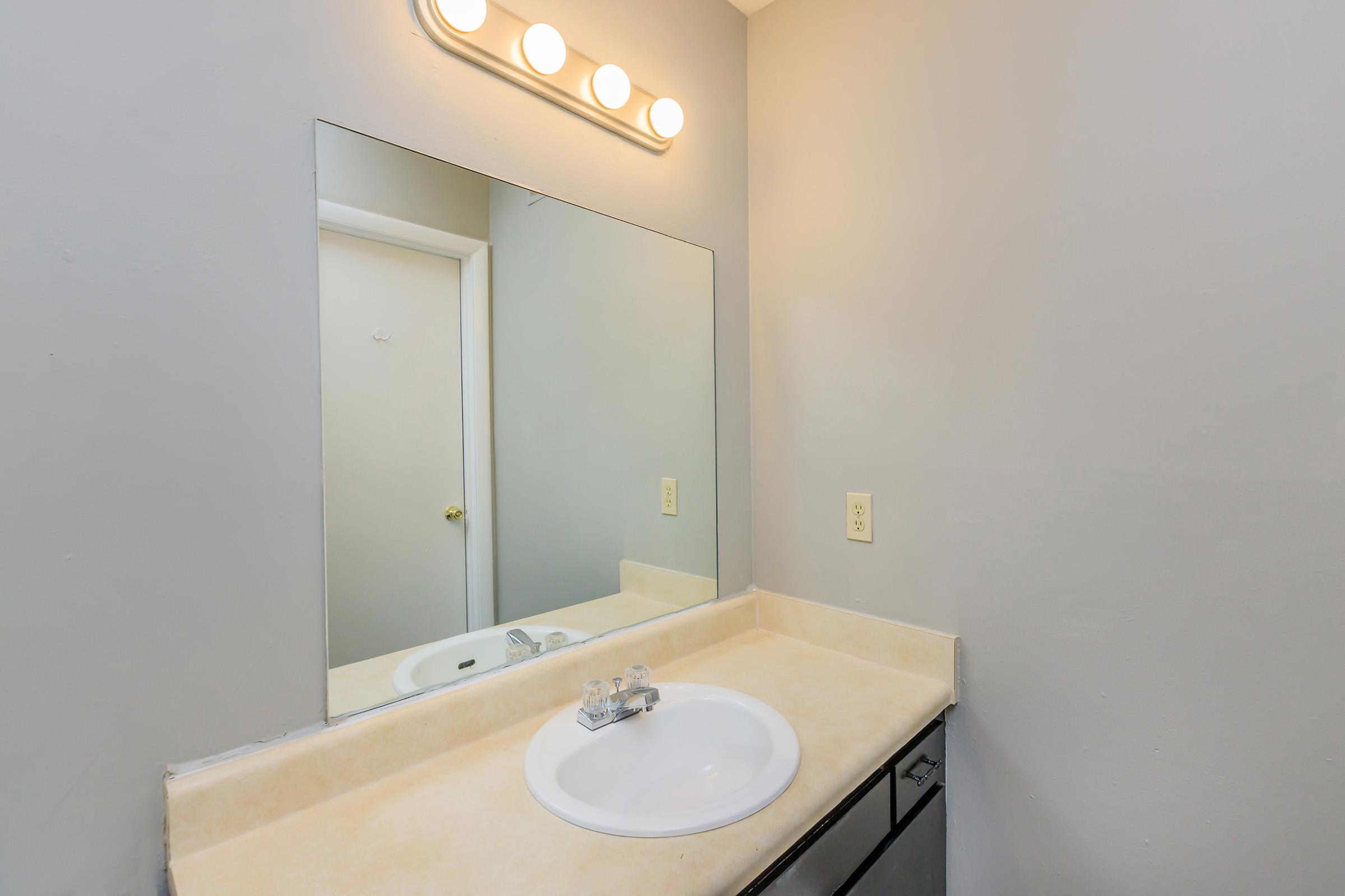 Large bathroom vanity with sink and mirror