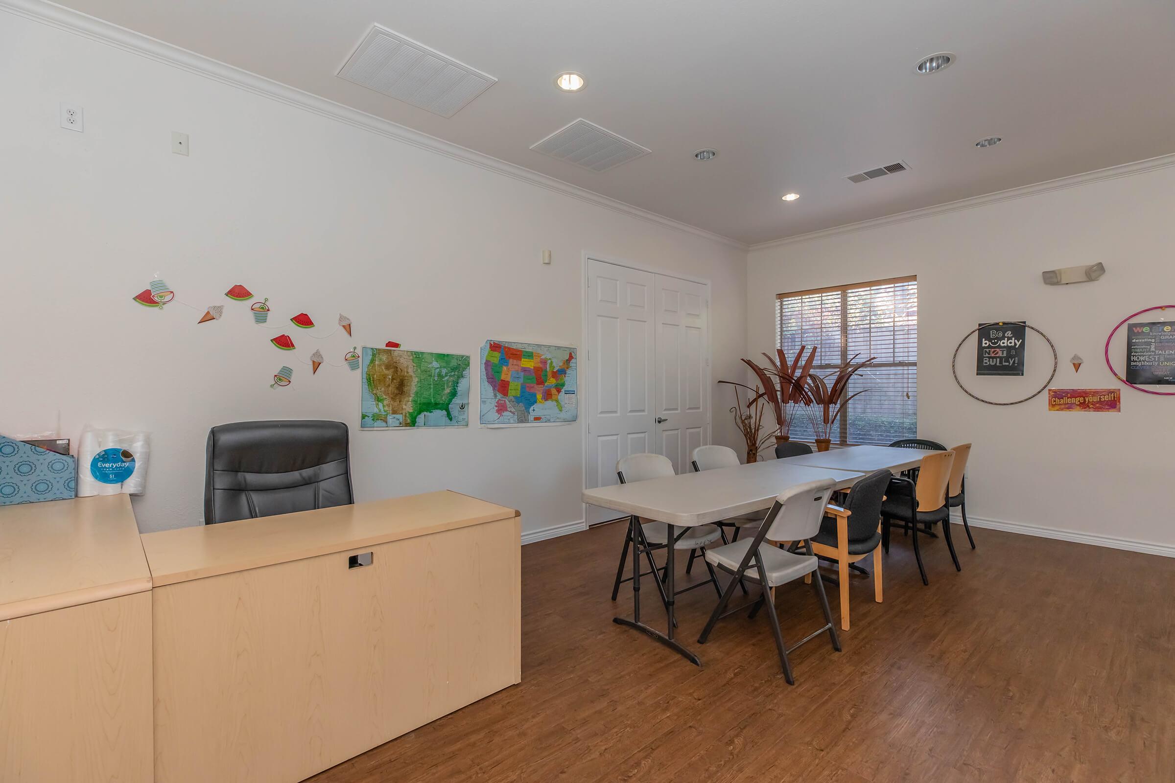 a room filled with furniture and a table