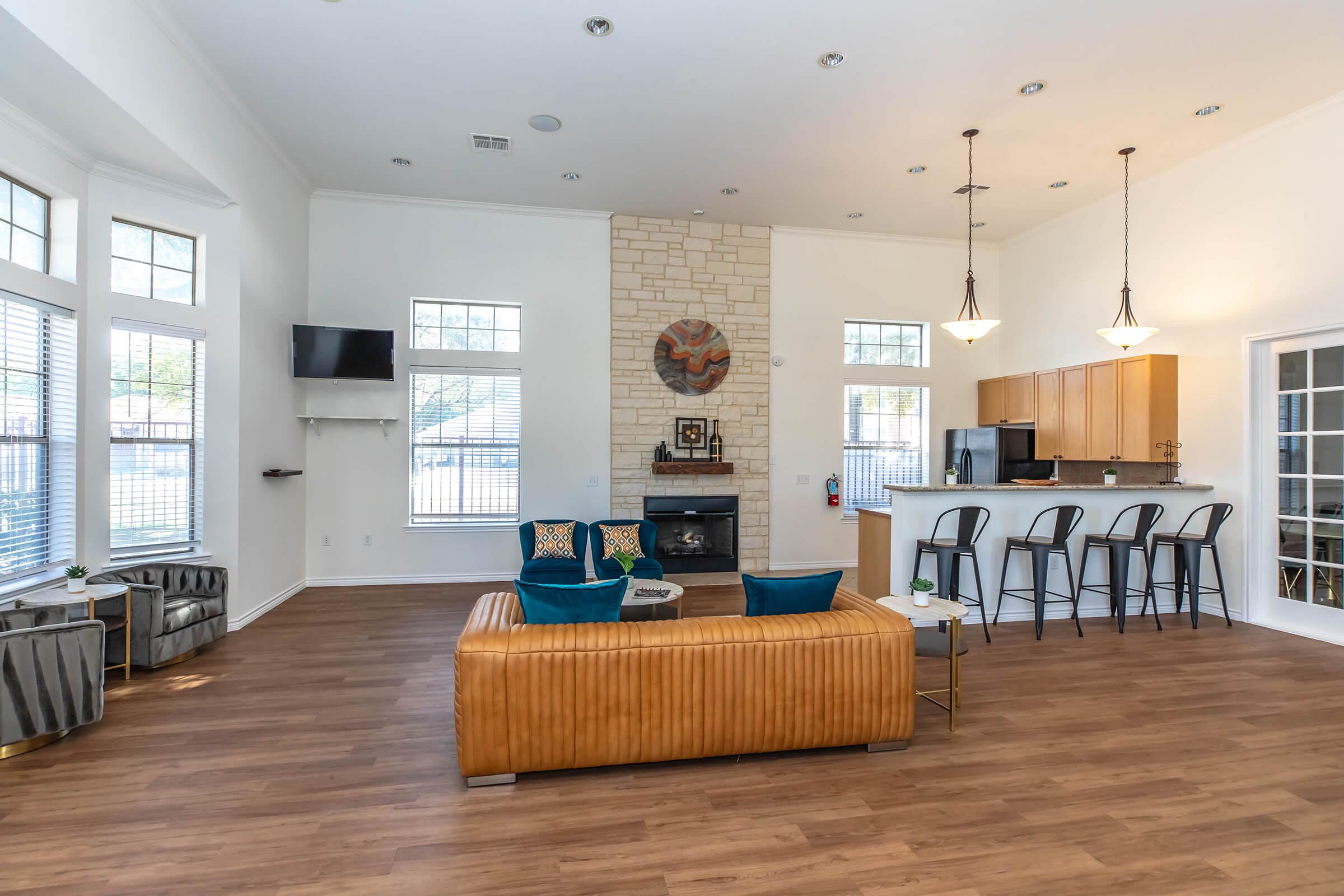 a living room filled with furniture and a large window