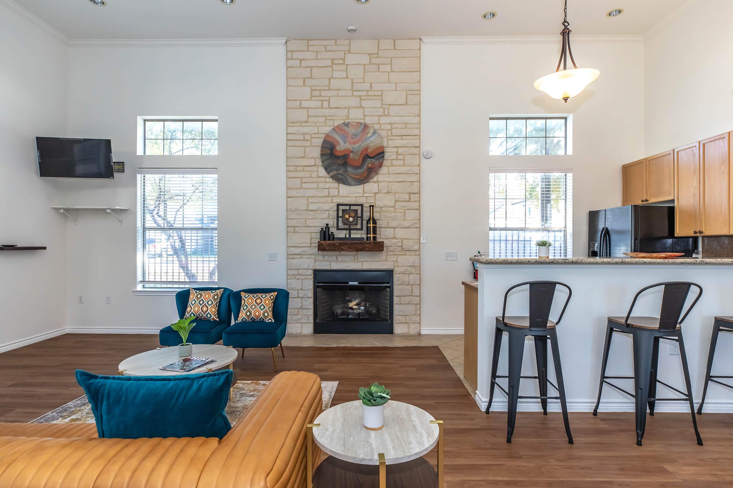 a living room filled with furniture and a fireplace