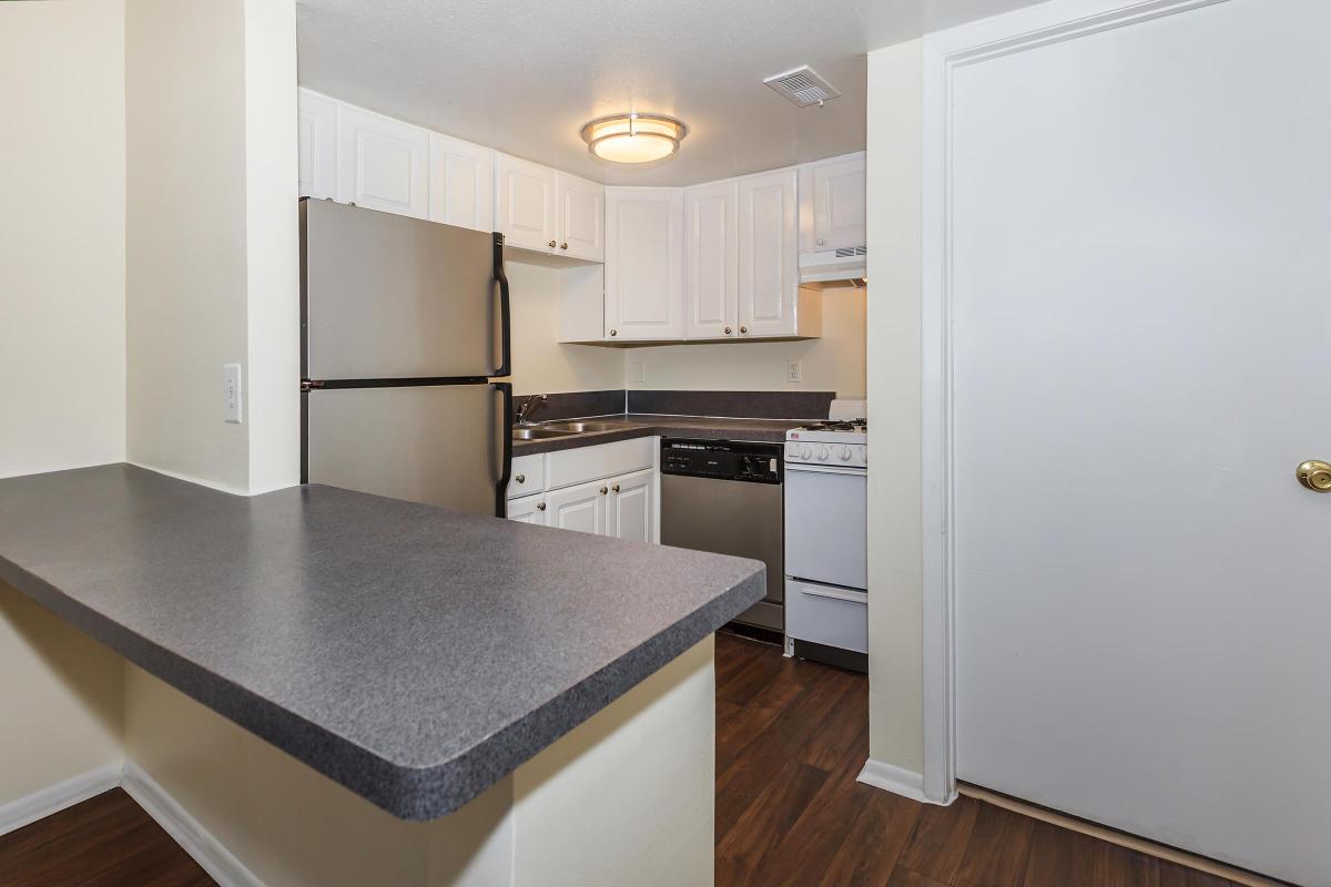 a kitchen with an island in the middle of a room