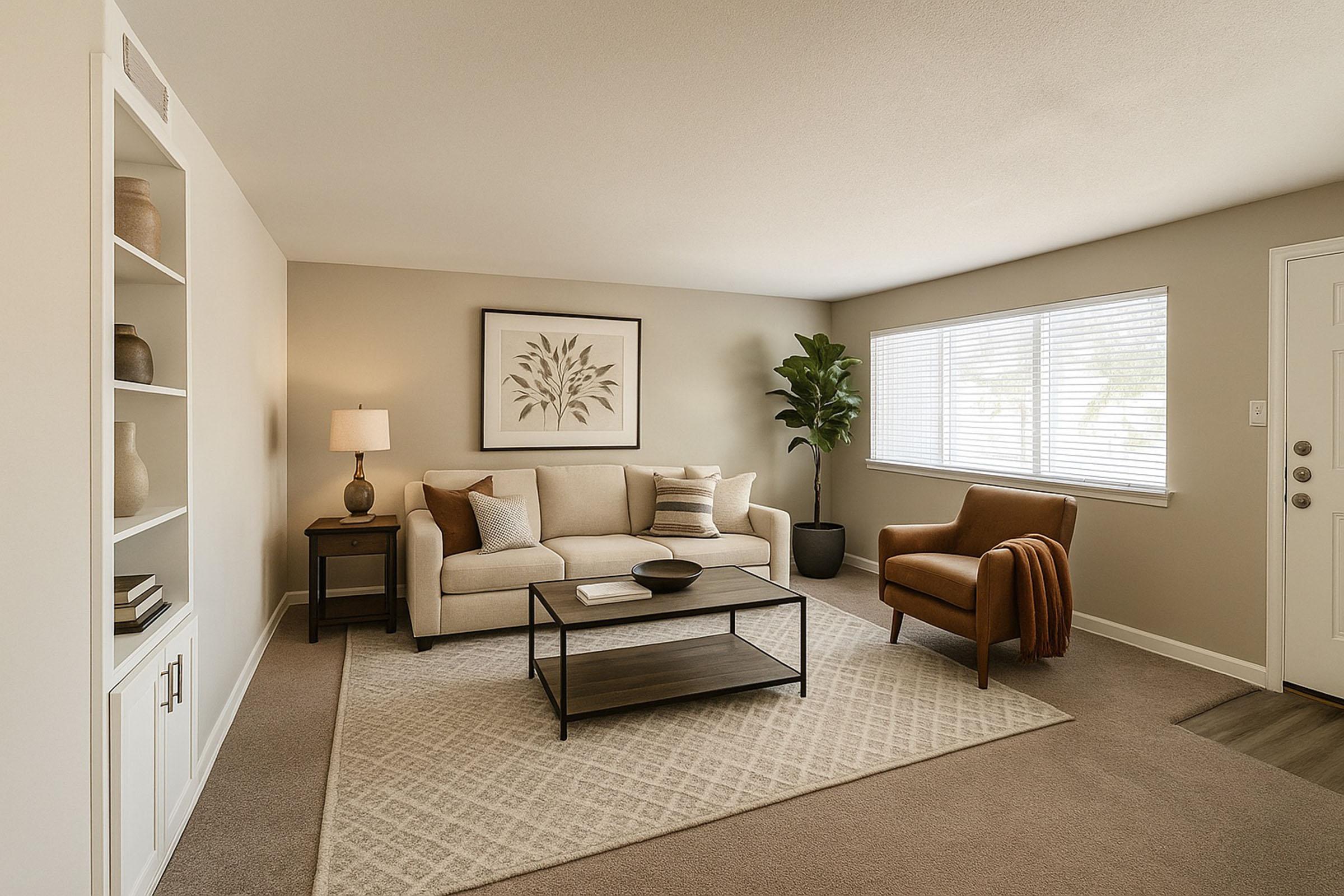 A modern living room featuring a beige sofa with decorative pillows, a brown armchair with a cozy throw, a rectangular coffee table, and a leafy plant in the corner. A lamp sits on a small side table next to the sofa, and light streams in through a window, complementing the neutral color scheme and soft textures.