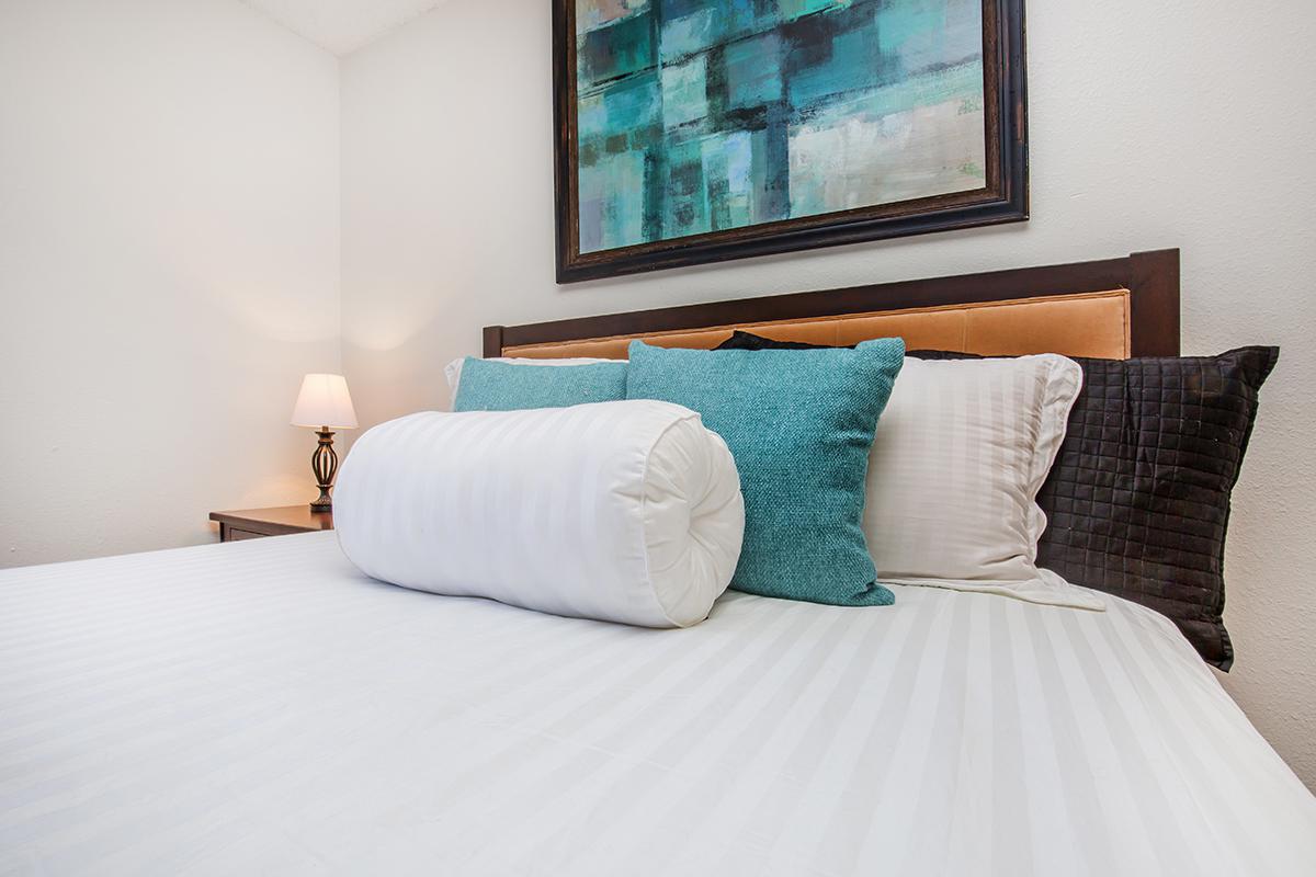 a made bed in a hotel room