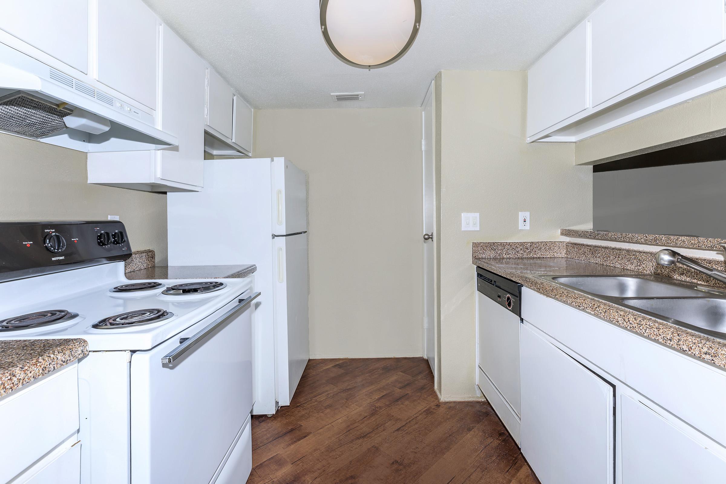 a kitchen with a stove top oven