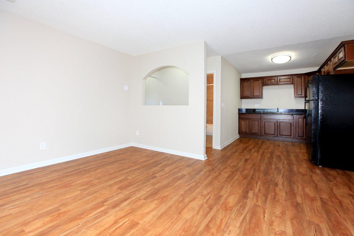 a large empty room with a hard wood floor