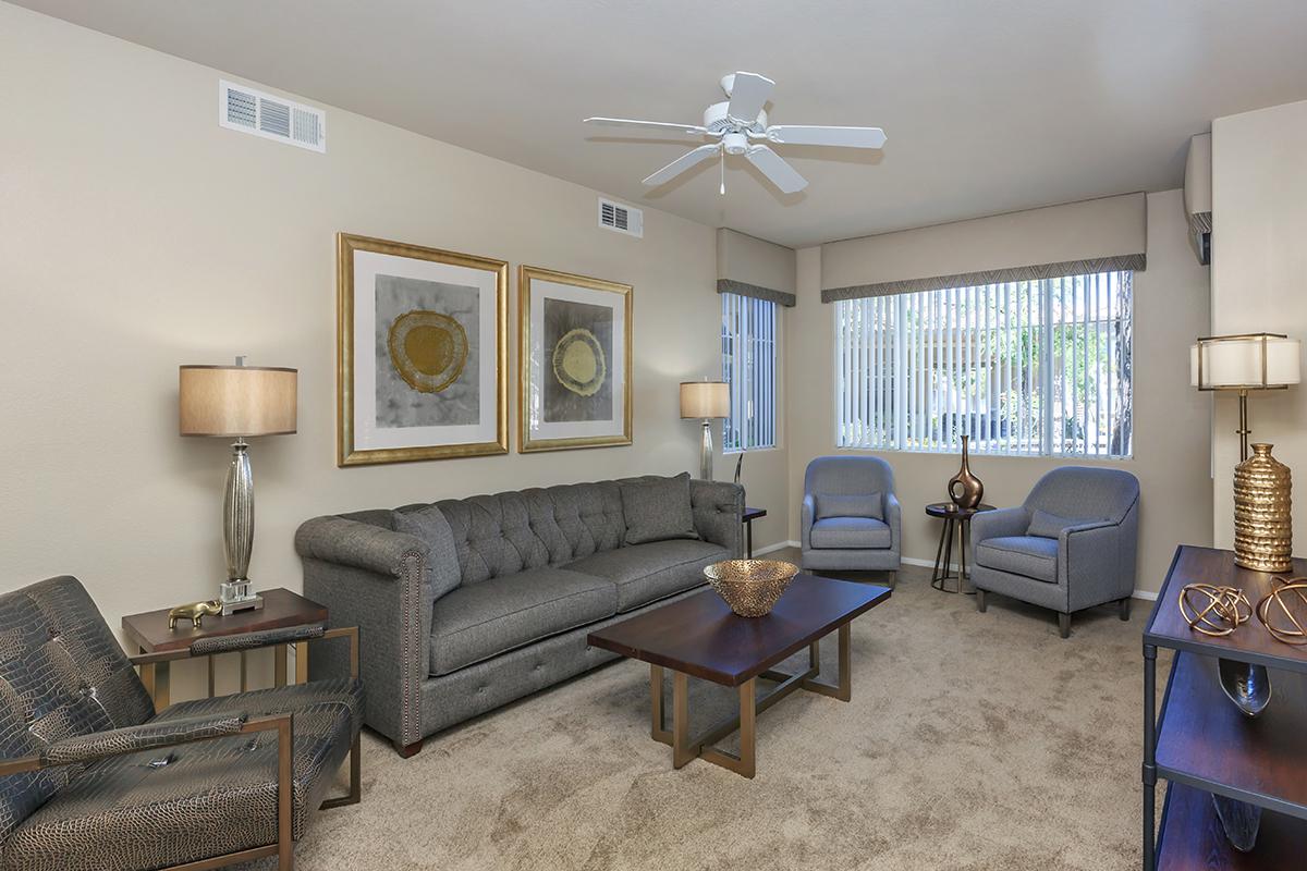 Ceiling Fans, Vertical Blinds, and Carpeted Floors in Homes at The Covington at Coronado Ranch Apartments