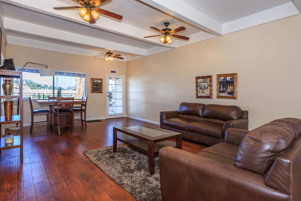 a living room filled with furniture and a table