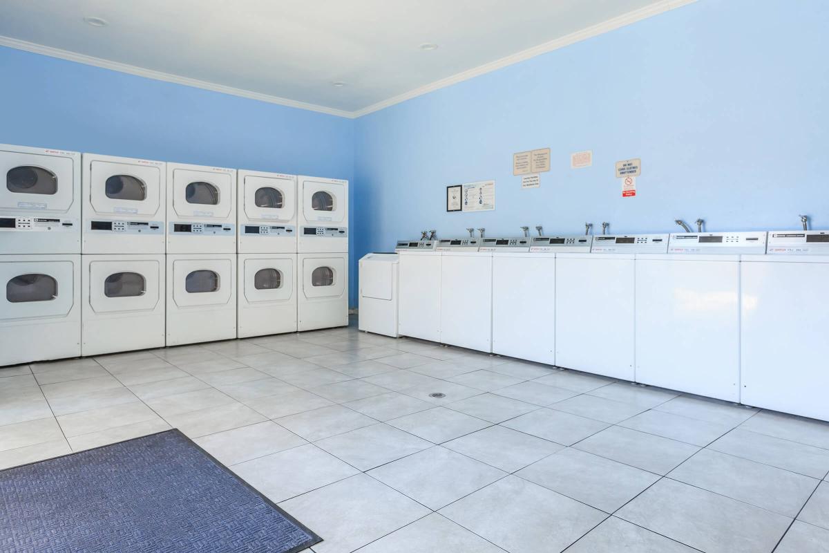 a kitchen with white cabinets