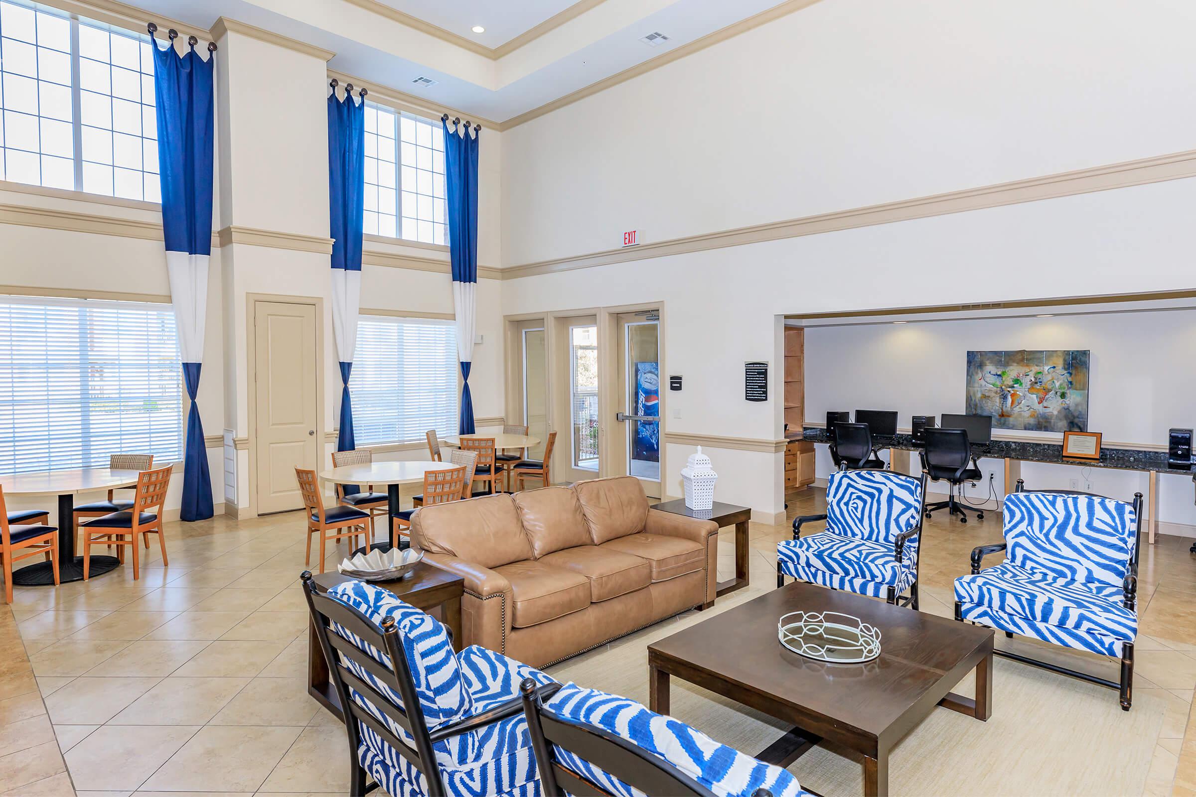 a living room filled with furniture and a fireplace