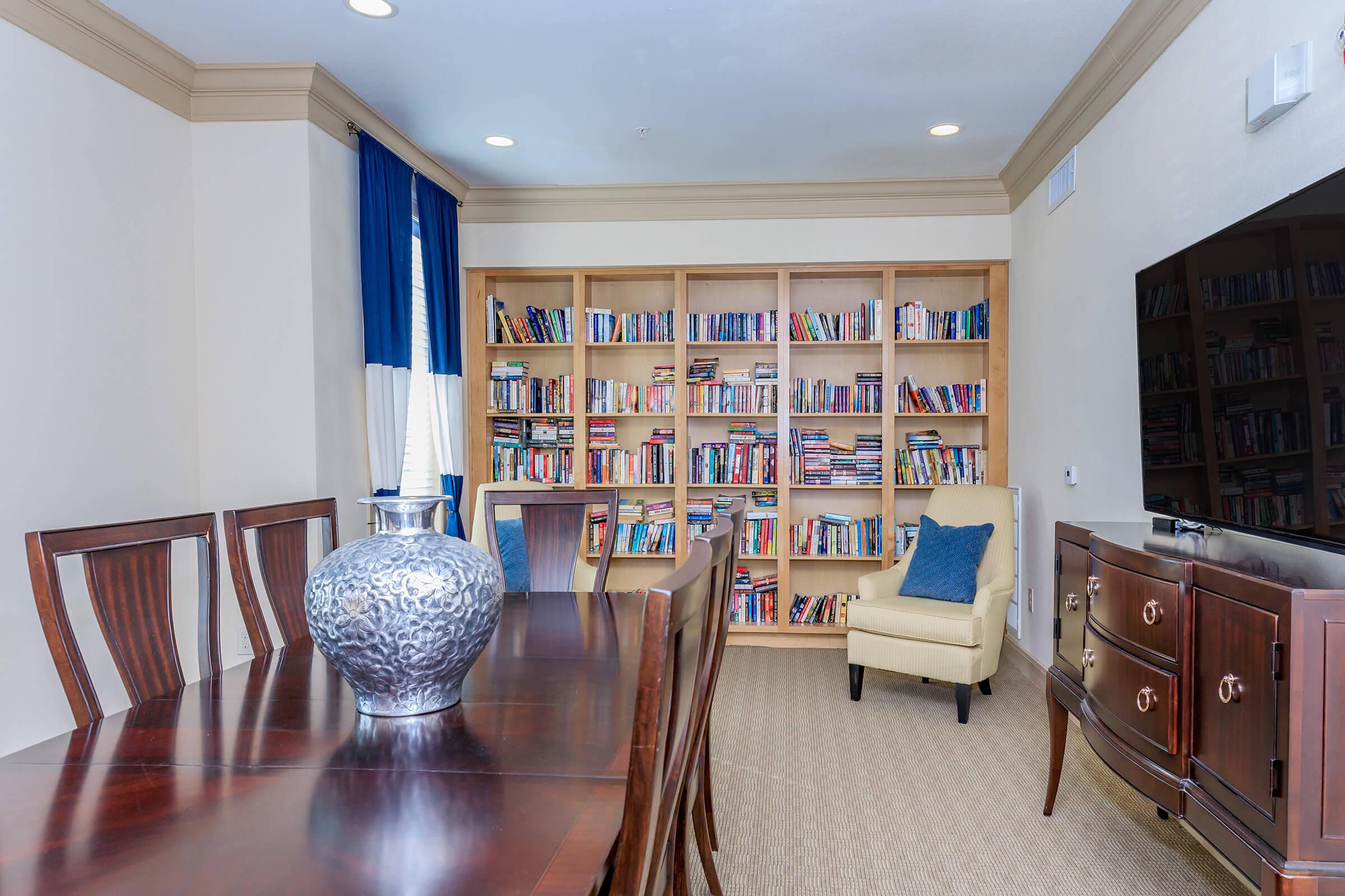 a room filled with furniture and vase on a table