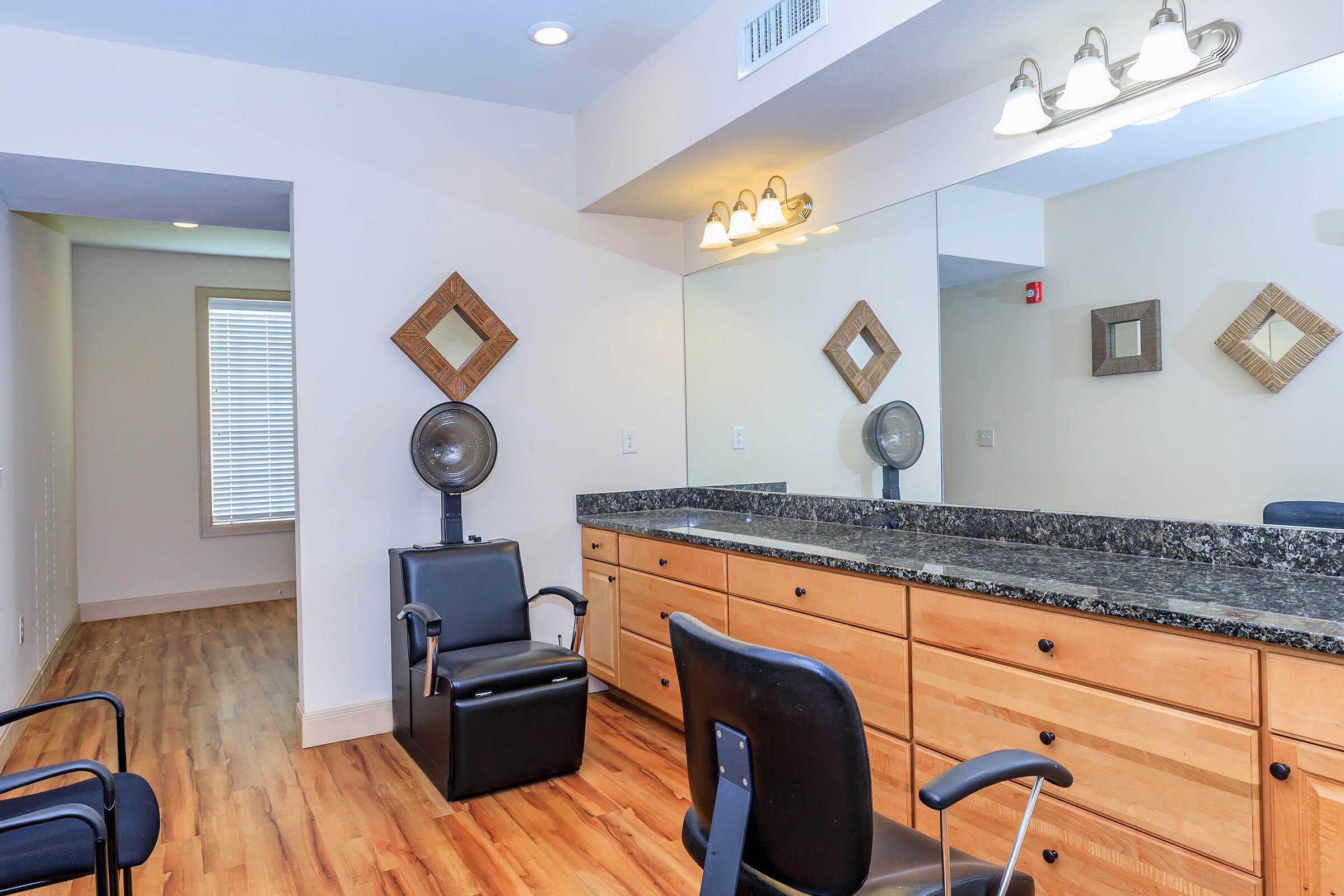 a bedroom with a desk and chair in a room