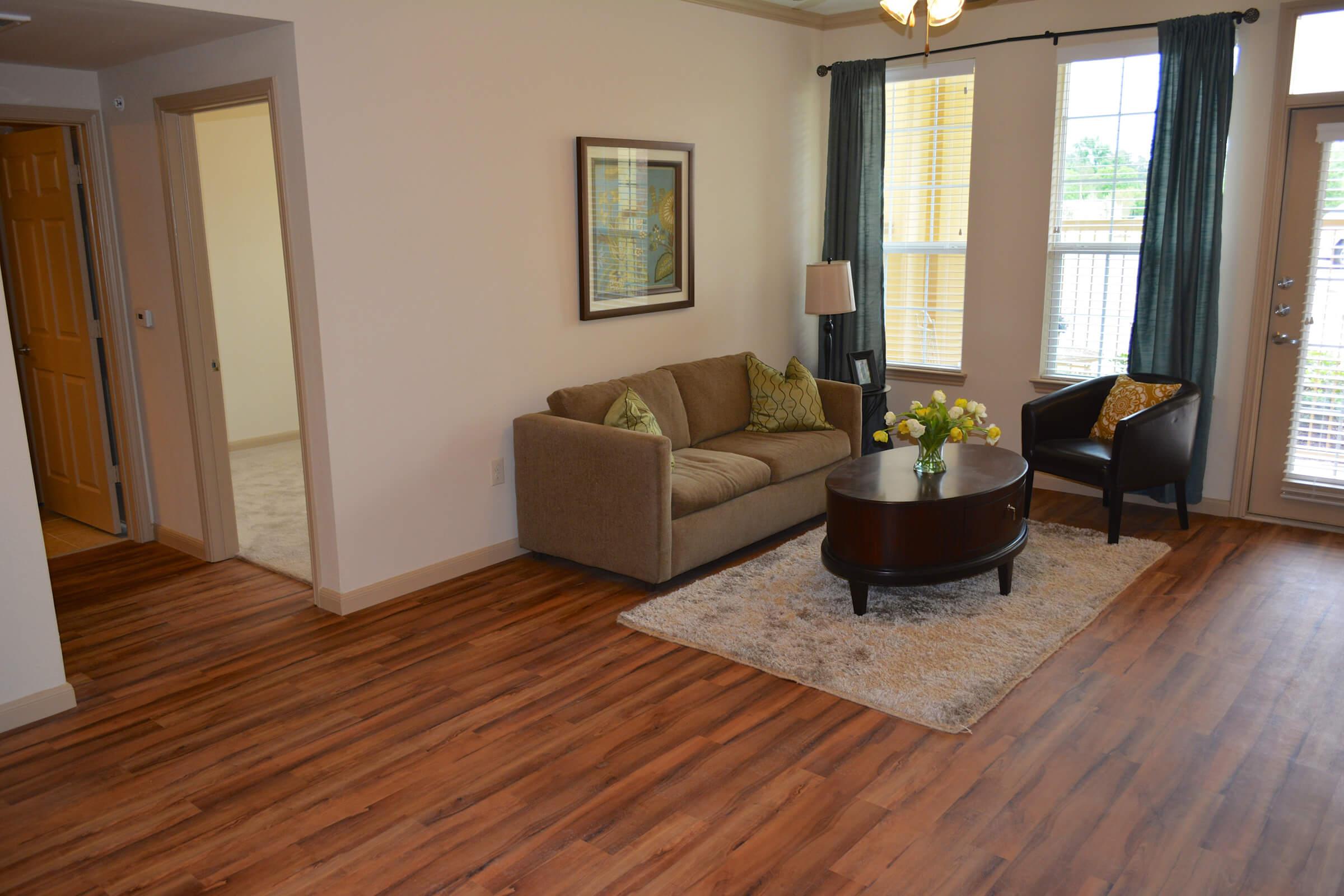 a living room with a wood floor