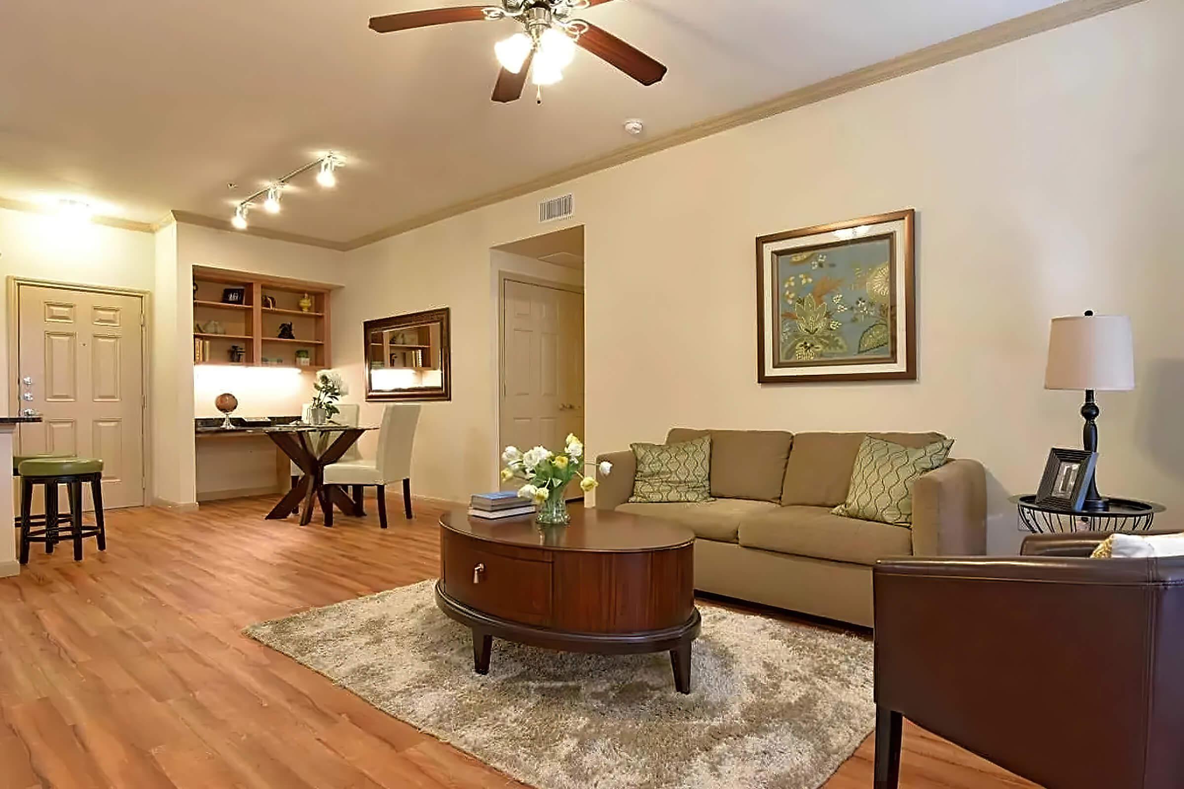 a living room filled with furniture and a fireplace