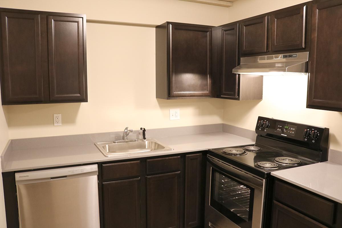 a kitchen with a sink and a microwave