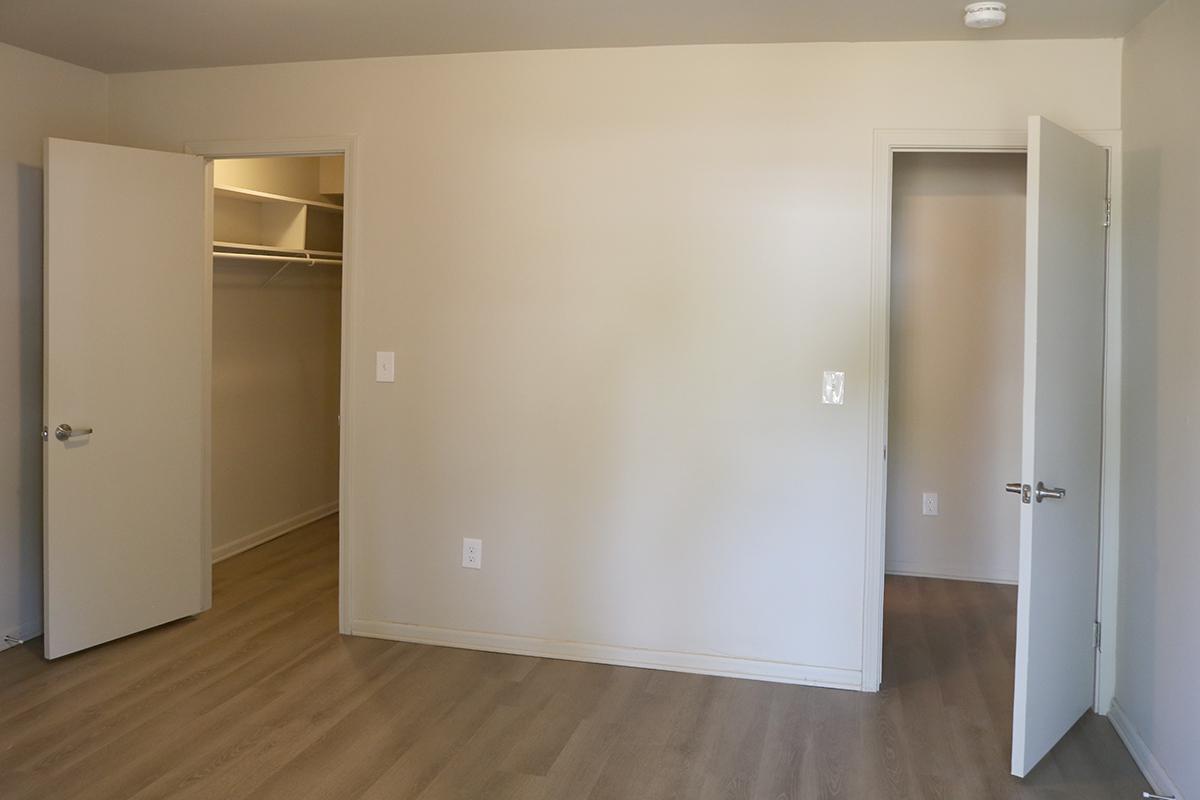 a large empty room with a wood floor