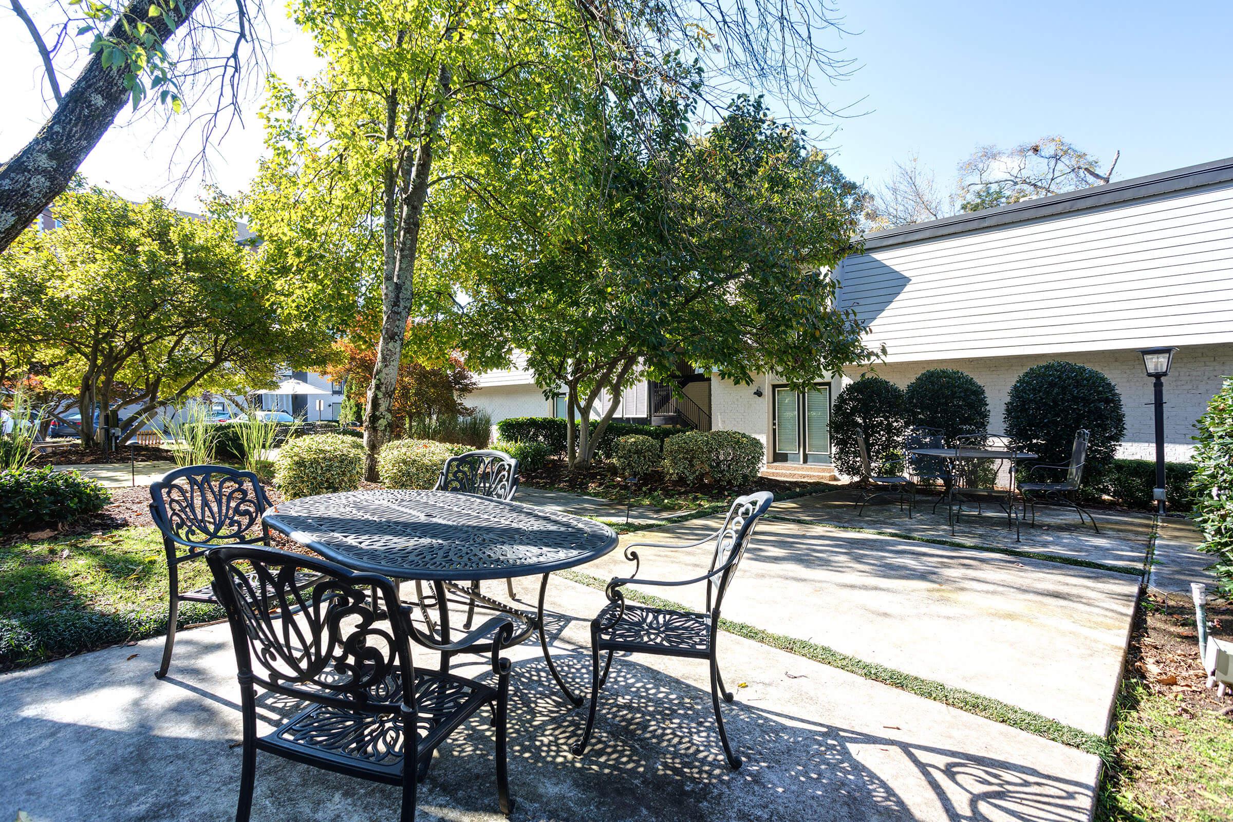 a group of lawn chairs sitting on top of a picnic table