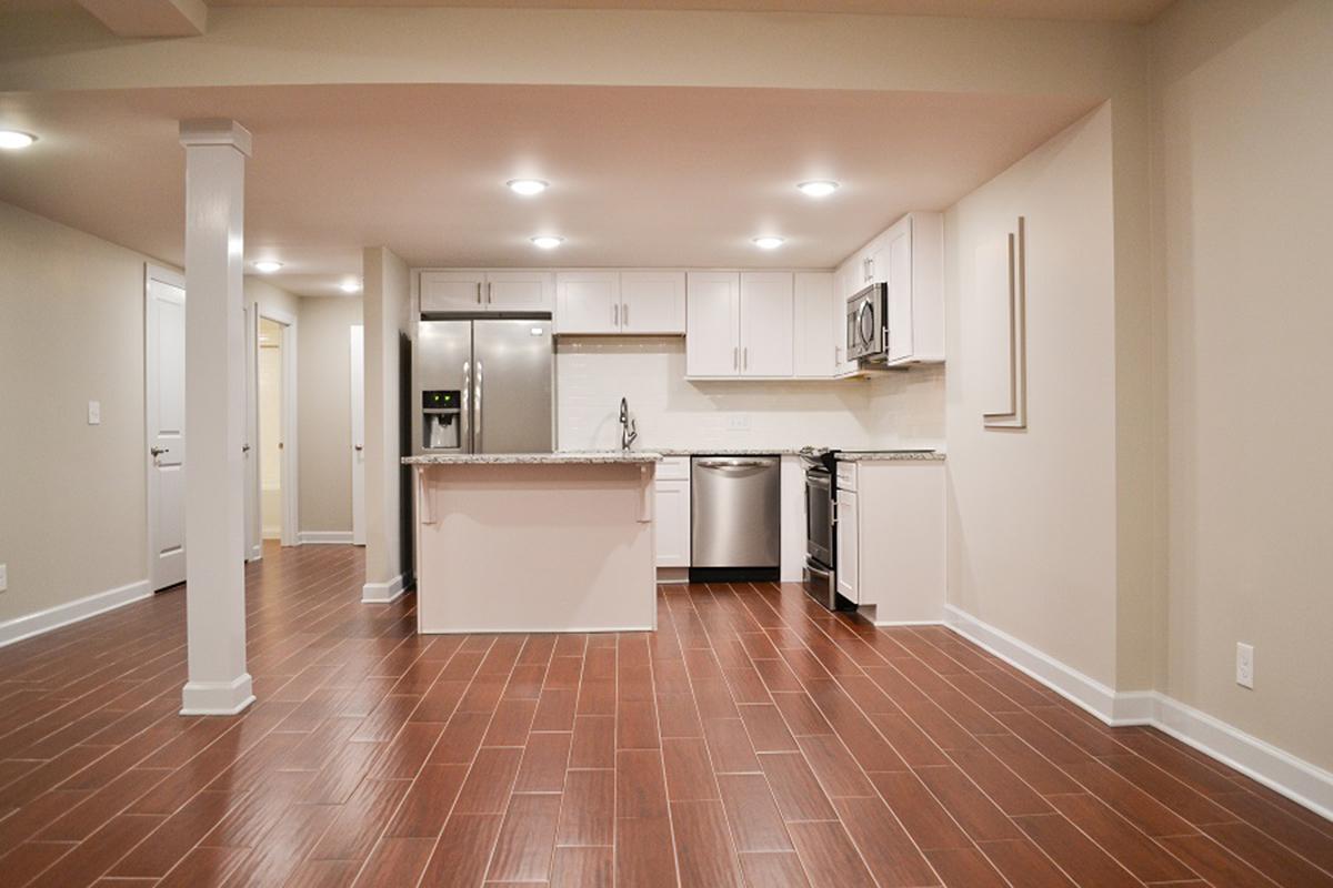 a kitchen with a hard wood floor