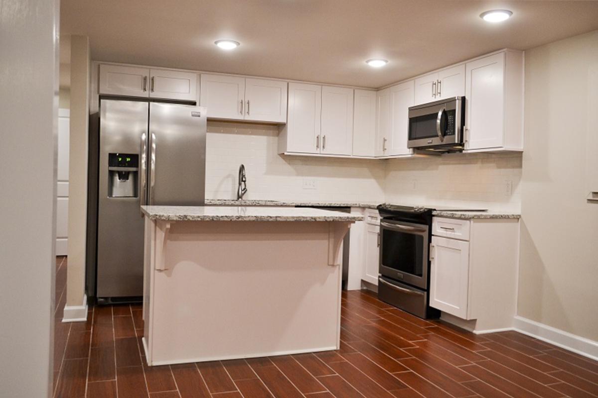 a large white refrigerator in a kitchen
