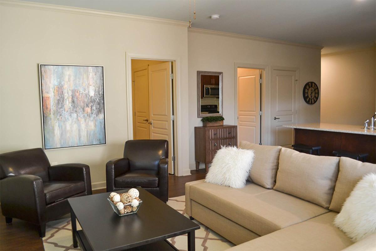 a living room filled with furniture and a flat screen tv