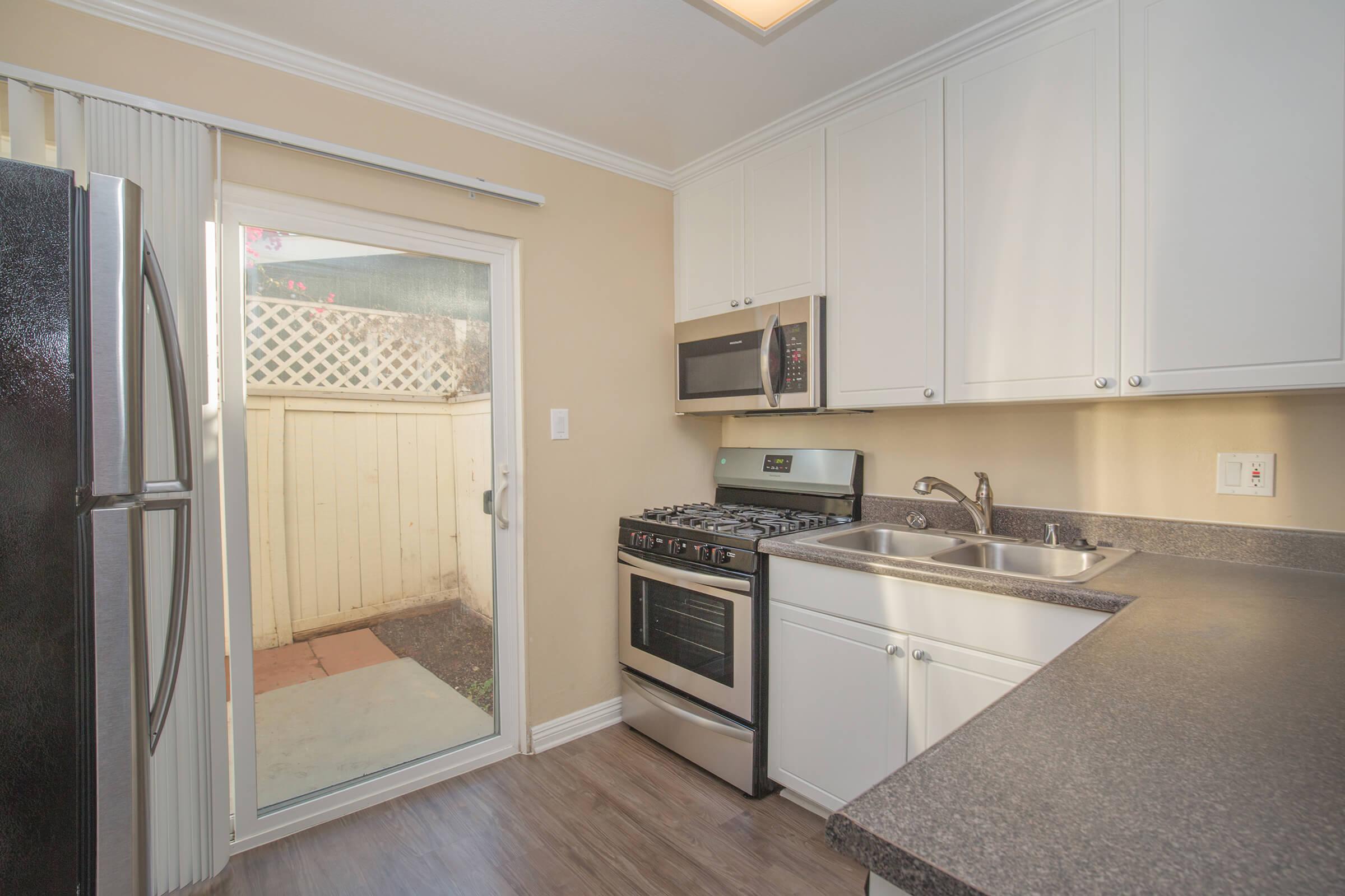 Kitchen with stainless steel appliances and white cabinets