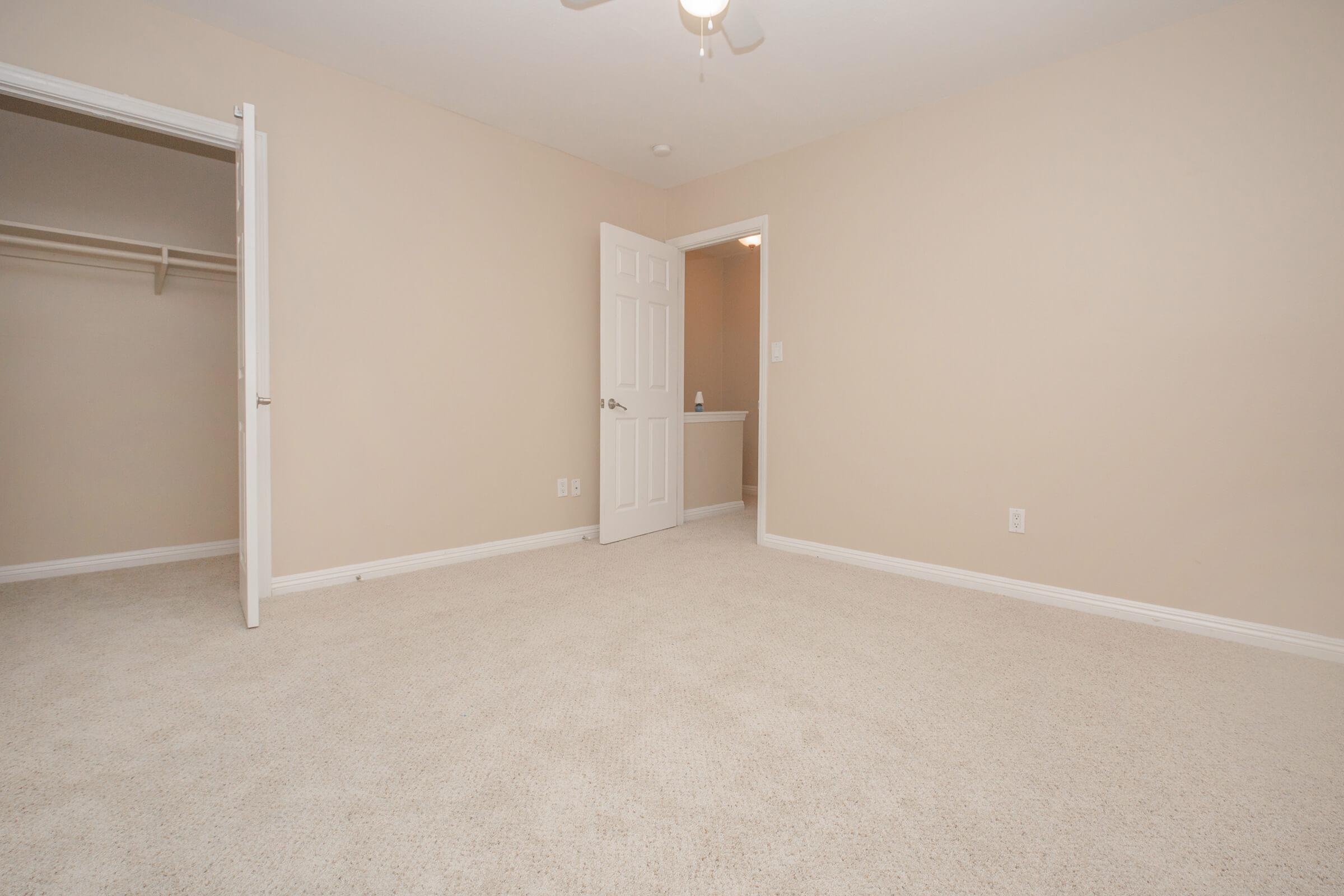 Vacant bedroom with open closet