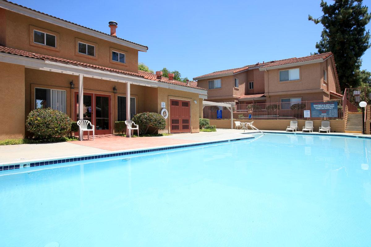 a large pool of water in front of a house