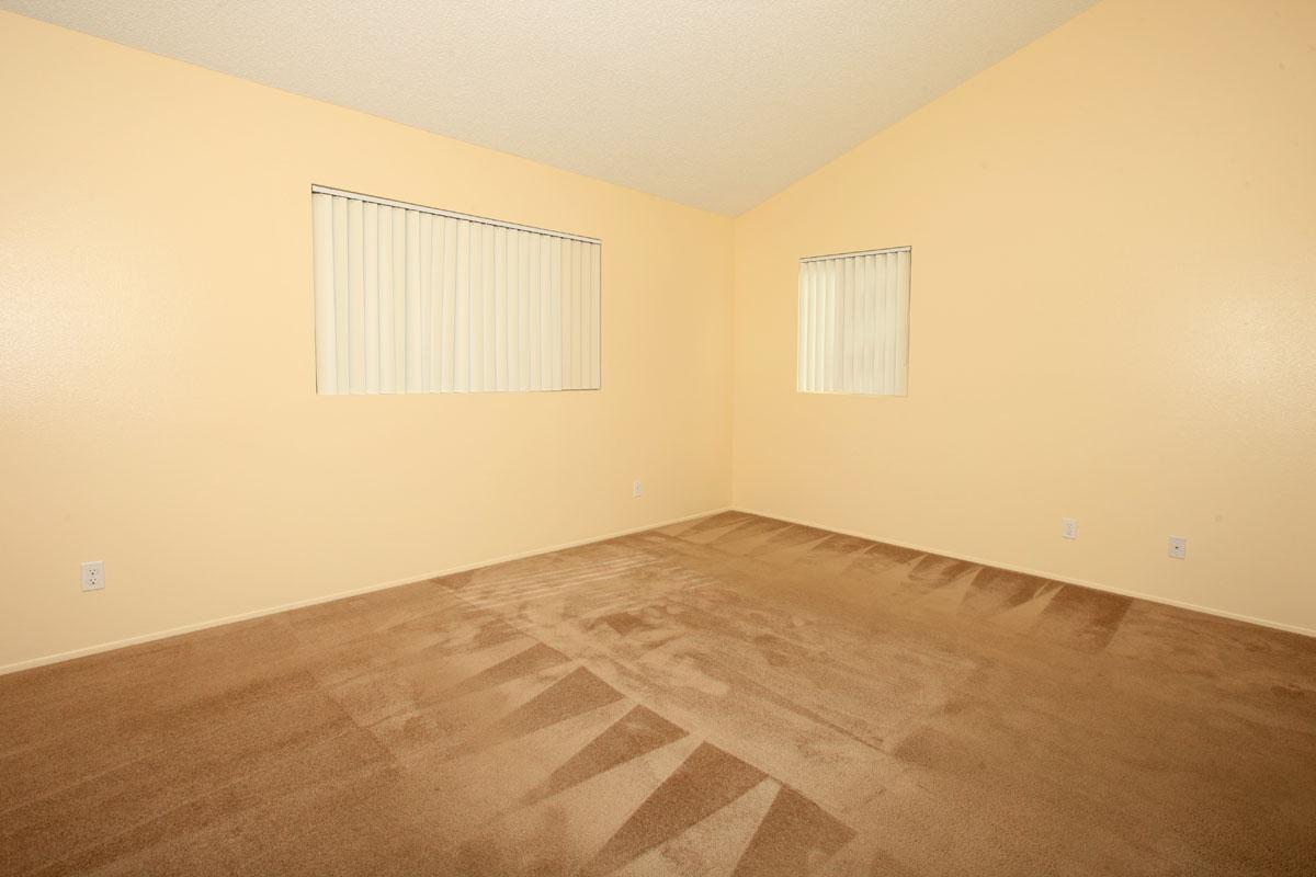 an empty bed in a room