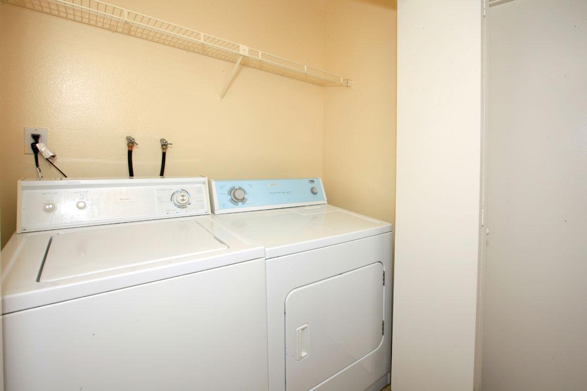 a white refrigerator freezer sitting in a room