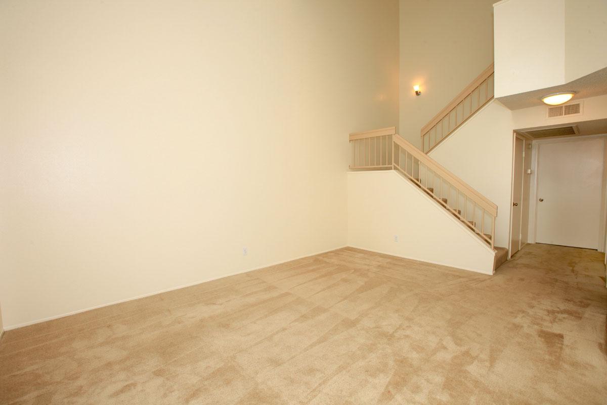 a bedroom with a bed in a room