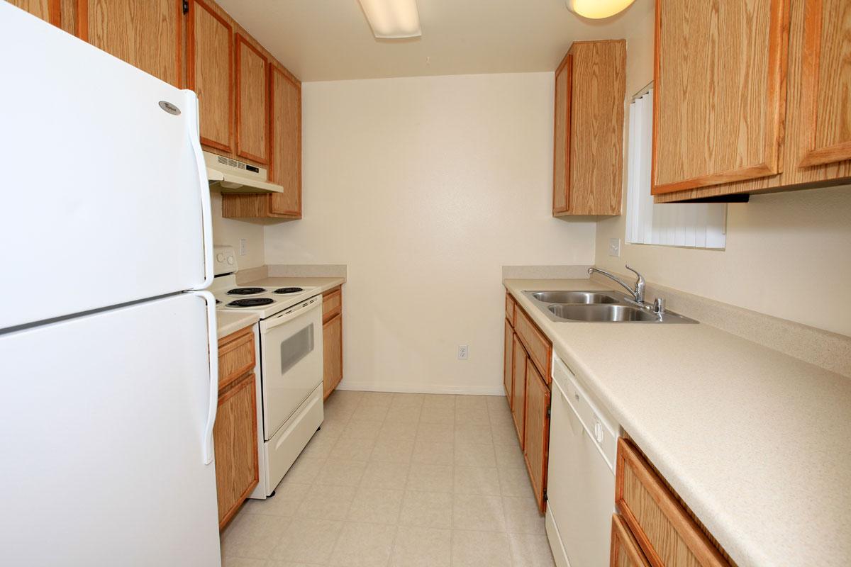 a white refrigerator freezer sitting inside of a kitchen