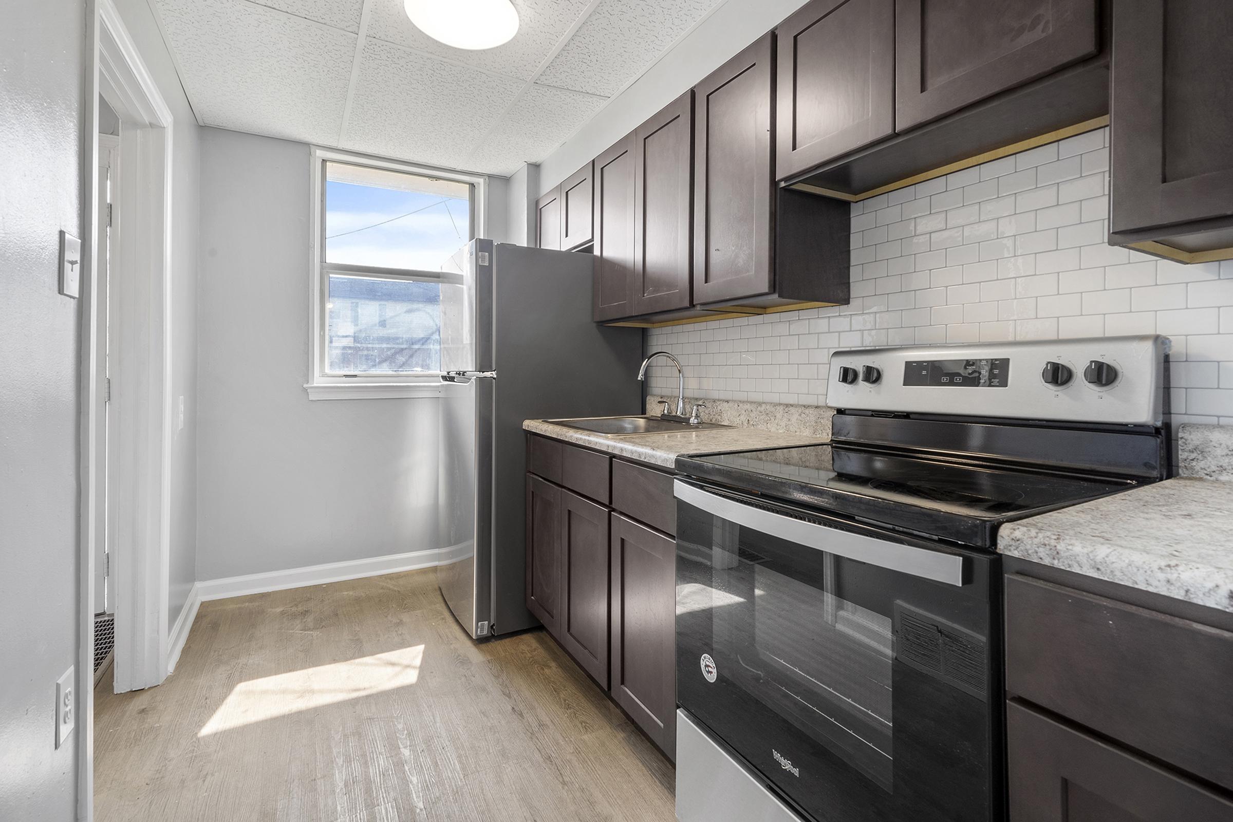 a large kitchen with stainless steel appliances