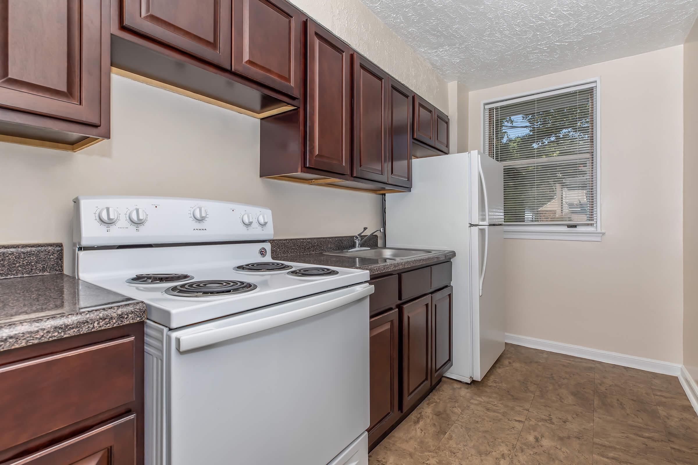 a kitchen with a stove and a sink